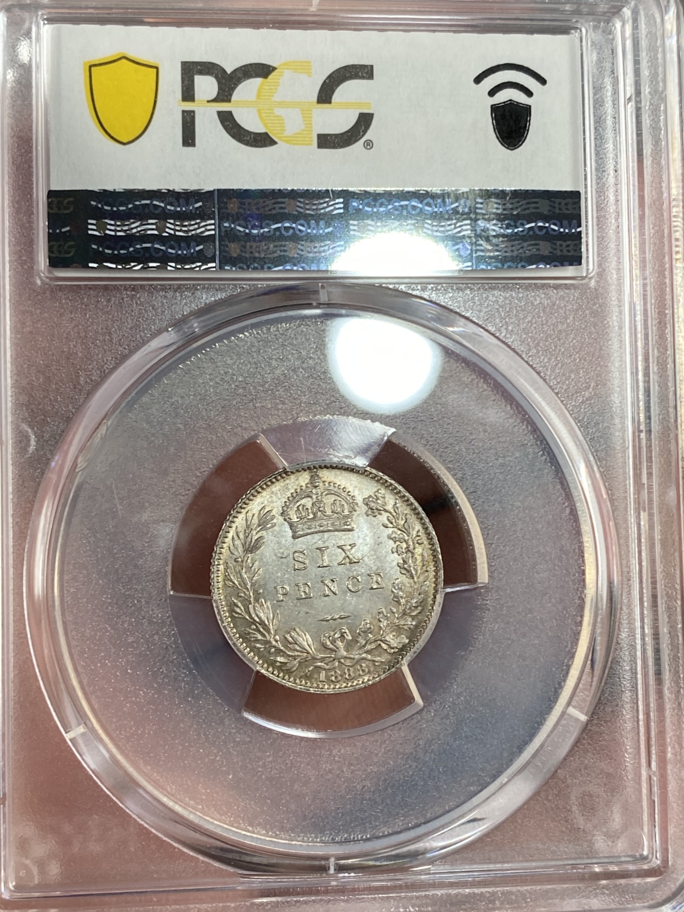 万国钱币拍卖第015期（奢华币章第二季） PCGS MS65 1888年英国维多利亚女王6便士银币 红色与金色的包浆环绕币面散发着耀眼的光泽