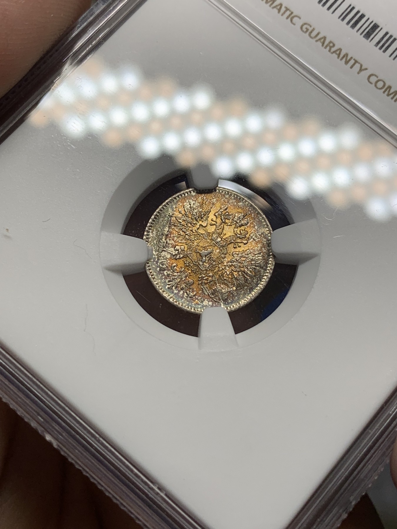 《竞宝斋》第193场-周日，周一 2场 (全场包邮) NGC MS63、MS64 俄占芬兰1916年25、50盆尼小银币一对，25盆尼是金色彩包浆，50芬尼略带淡金包浆，都非常漂亮