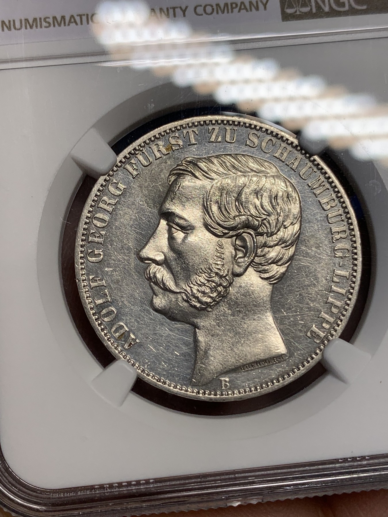 《竞宝斋》第193场-周日，周一 2场 (全场包邮) NGC-UNC 1865年德国绍姆堡利普天使1泰勒银币（发行7000枚的德系小珍）状态好 可以养养包浆试试