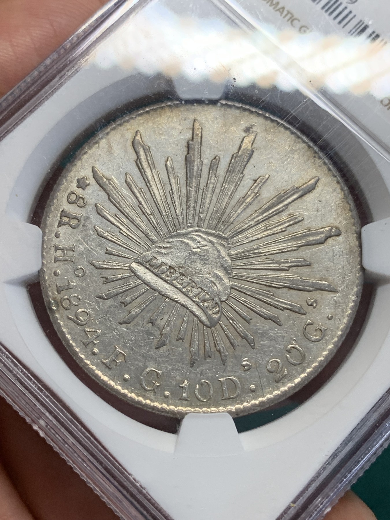 《竞宝斋》第193场-周日，周一 2场 (全场包邮) NGC-AU55 墨西哥 花边鹰洋 8瑞尔银币 1894 HO FG 稀少厂别 铸造量仅50万枚
