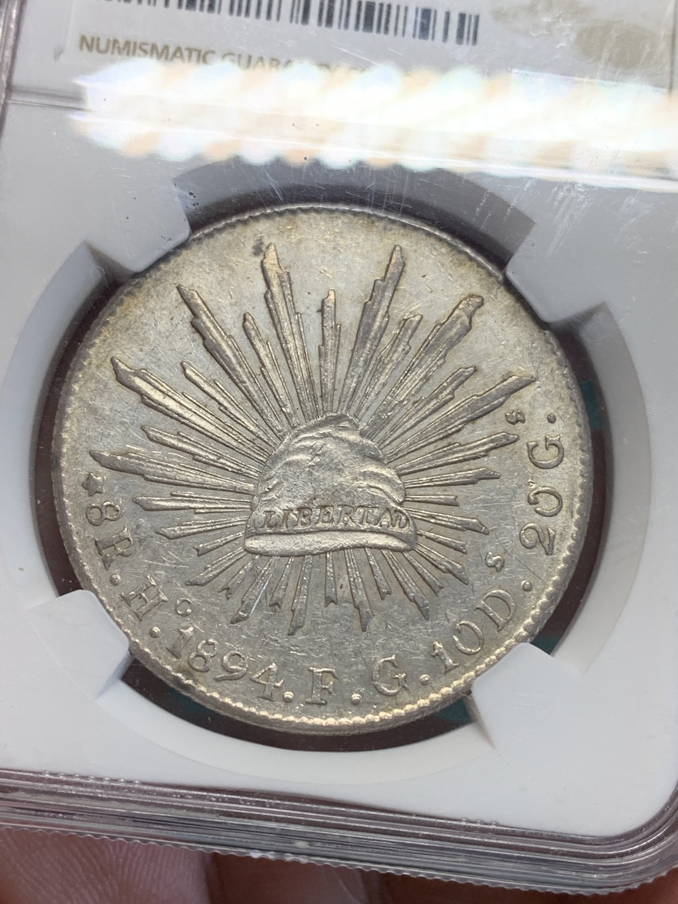 《竞宝斋》第193场-周日，周一 2场 (全场包邮) NGC-AU55 墨西哥 花边鹰洋 8瑞尔银币 1894 HO FG 稀少厂别 铸造量仅50万枚