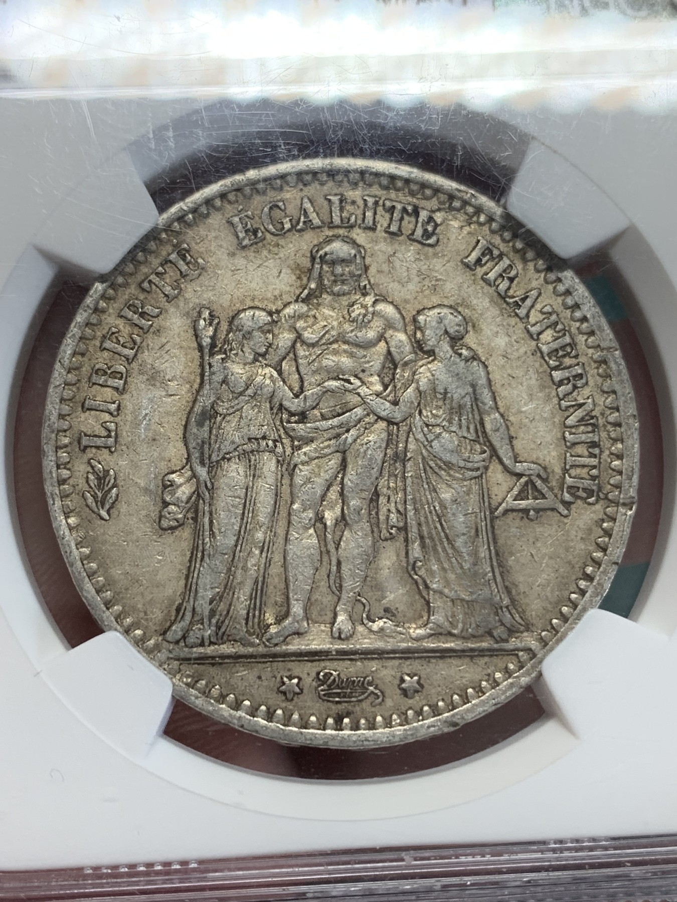 《竞宝斋》第193场-周日，周一 2场 (全场包邮) NGC AU55 法国1875年大力神5法郎银币 小A版 铸造量是1873年的1/10