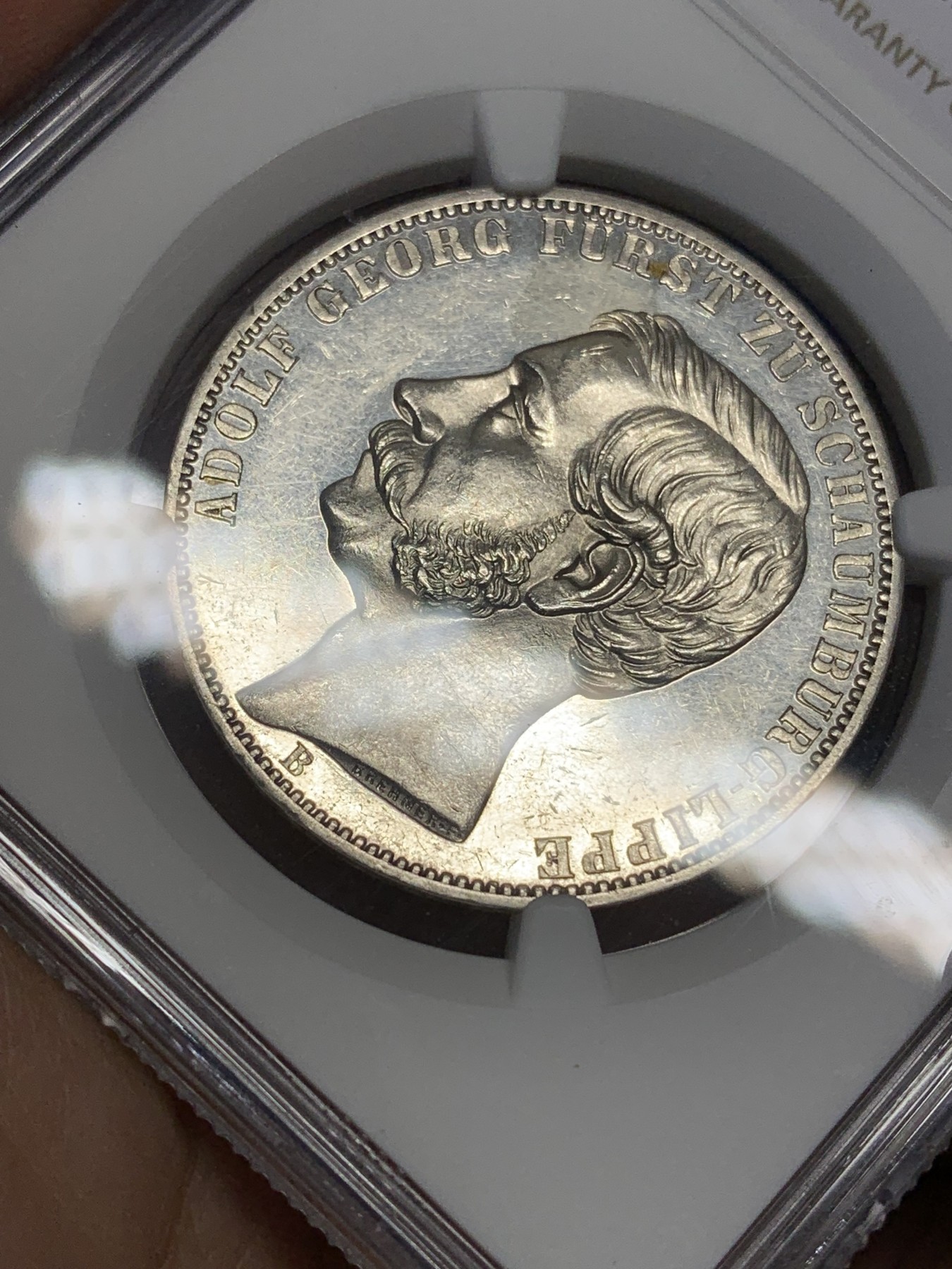 《竞宝斋》第193场-周日，周一 2场 (全场包邮) NGC-UNC 1865年德国绍姆堡利普天使1泰勒银币（发行7000枚的德系小珍）状态好 可以养养包浆试试