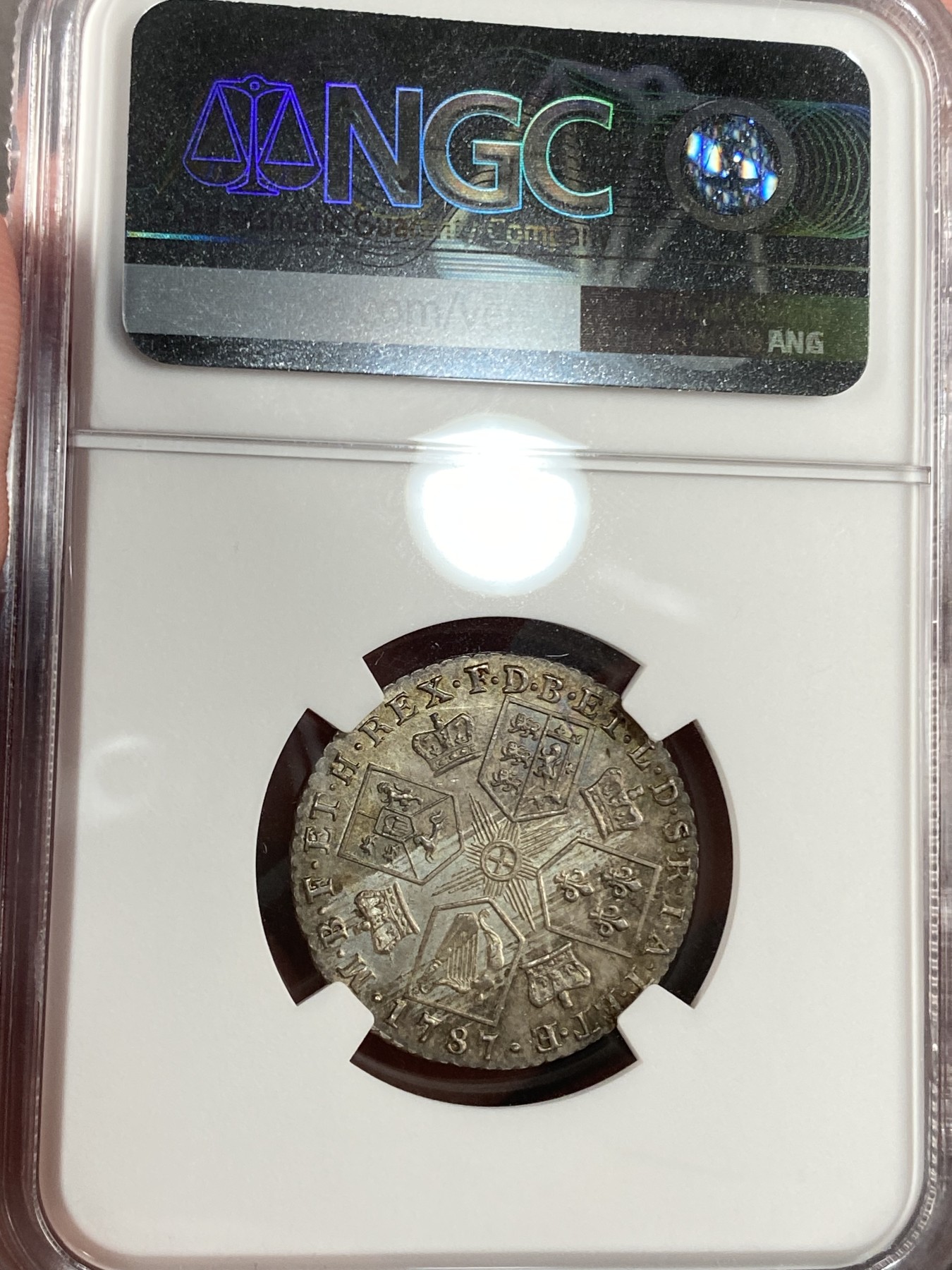 万国钱币拍卖第015期（奢华币章第二季） NGC MS63 1787年英国乔治三世1先令 丝绸般的底板表明它是从一对高度抛光的模具中压制出来的 这些压印在乔三的脸颊和皇冠上闪闪发光