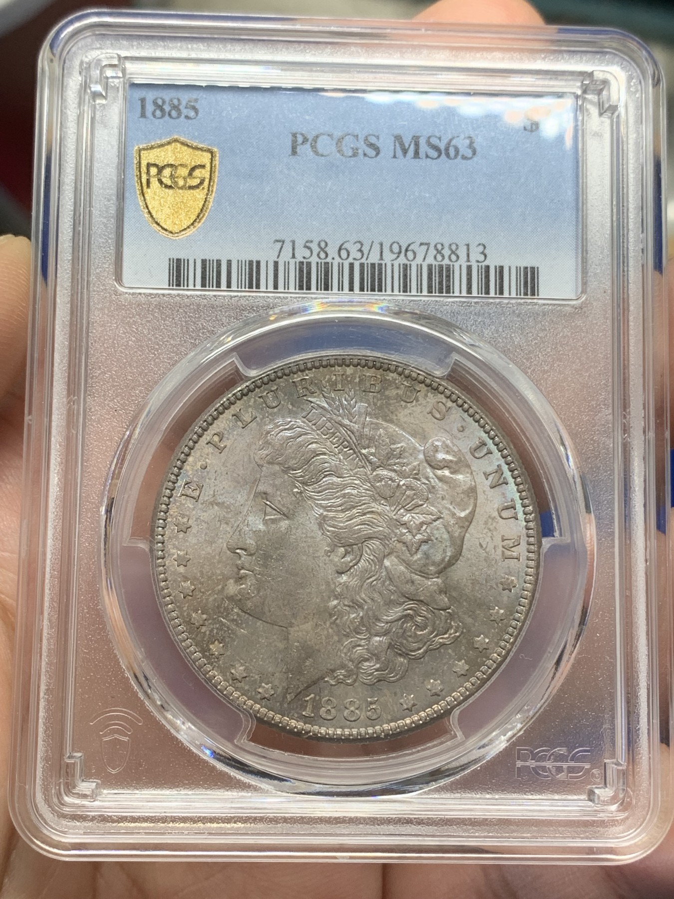《竞宝斋》第193场-周日，周一 2场 (全场包邮) PCGS-MS63 美国 1885年 1美元 摩根银币 正面五彩包浆 很漂亮