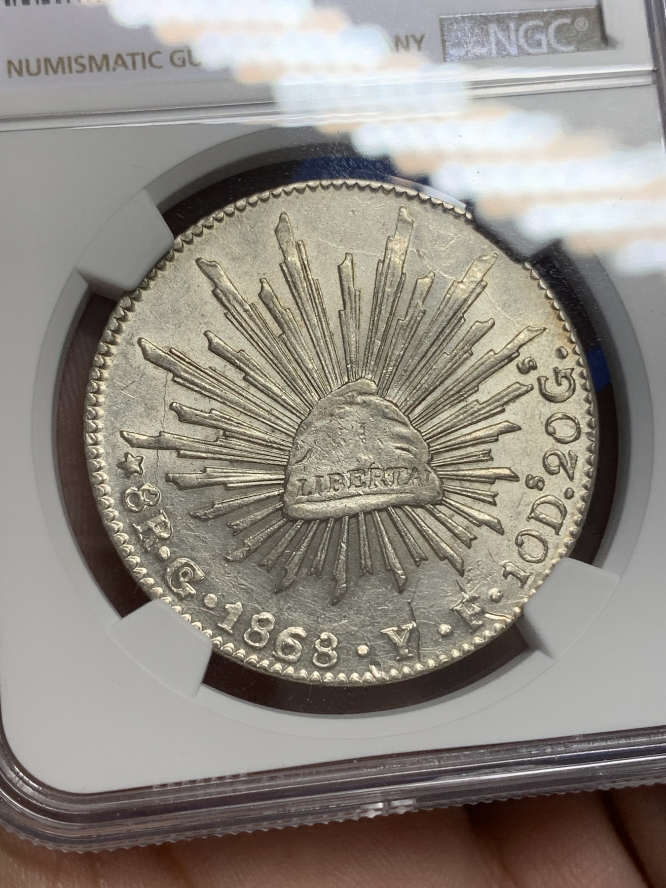 《竞宝斋》第193场-周日，周一 2场 (全场包邮) NGC-UNCD墨西哥1868/58年中期鹰洋 少见骑字版 好状态强转光可惜有道划痕未给分