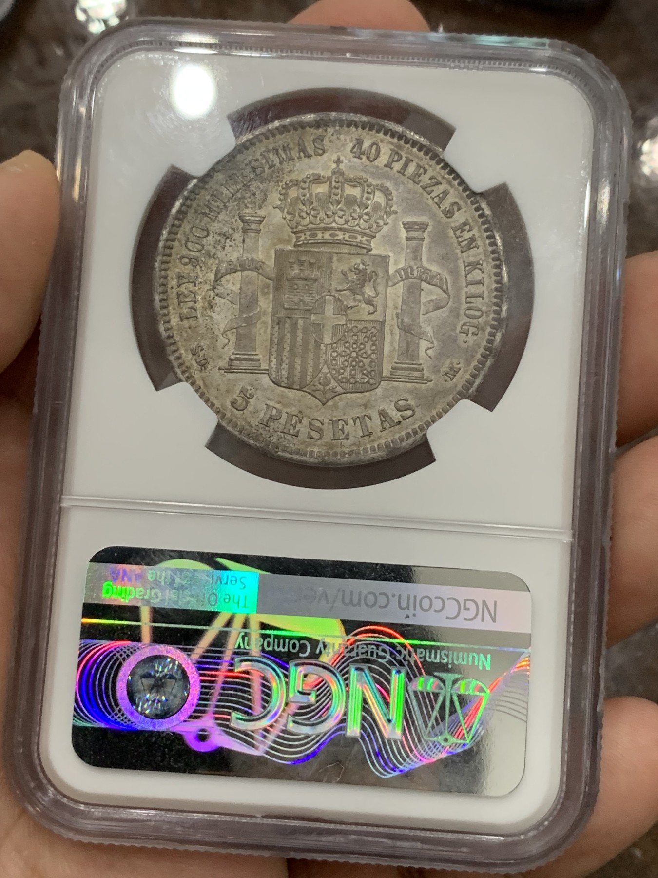 《竞宝斋》第194场-周日，周一 2场 (全场包邮) NGC-MS63 西班牙 1871年 阿马迪奥一世 5比塞塔双柱银币，难得高分，正反深五彩包浆，均匀且自然，稀缺品种高分难觅