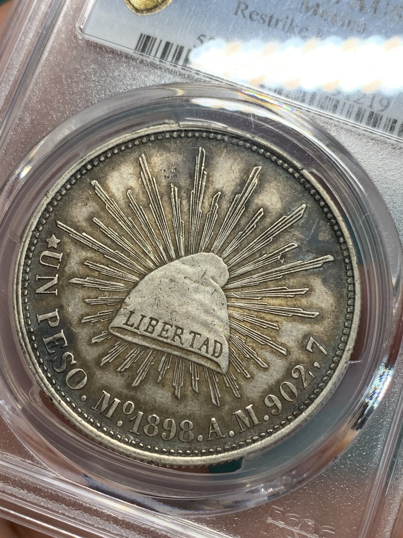 《竞宝斋》第194场-周日，周一 2场 (全场包邮) PCGS-AU50 墨西哥1898年鹰洋1比索银元  后铸版，五彩入骨包浆，压印清晰，味道极好