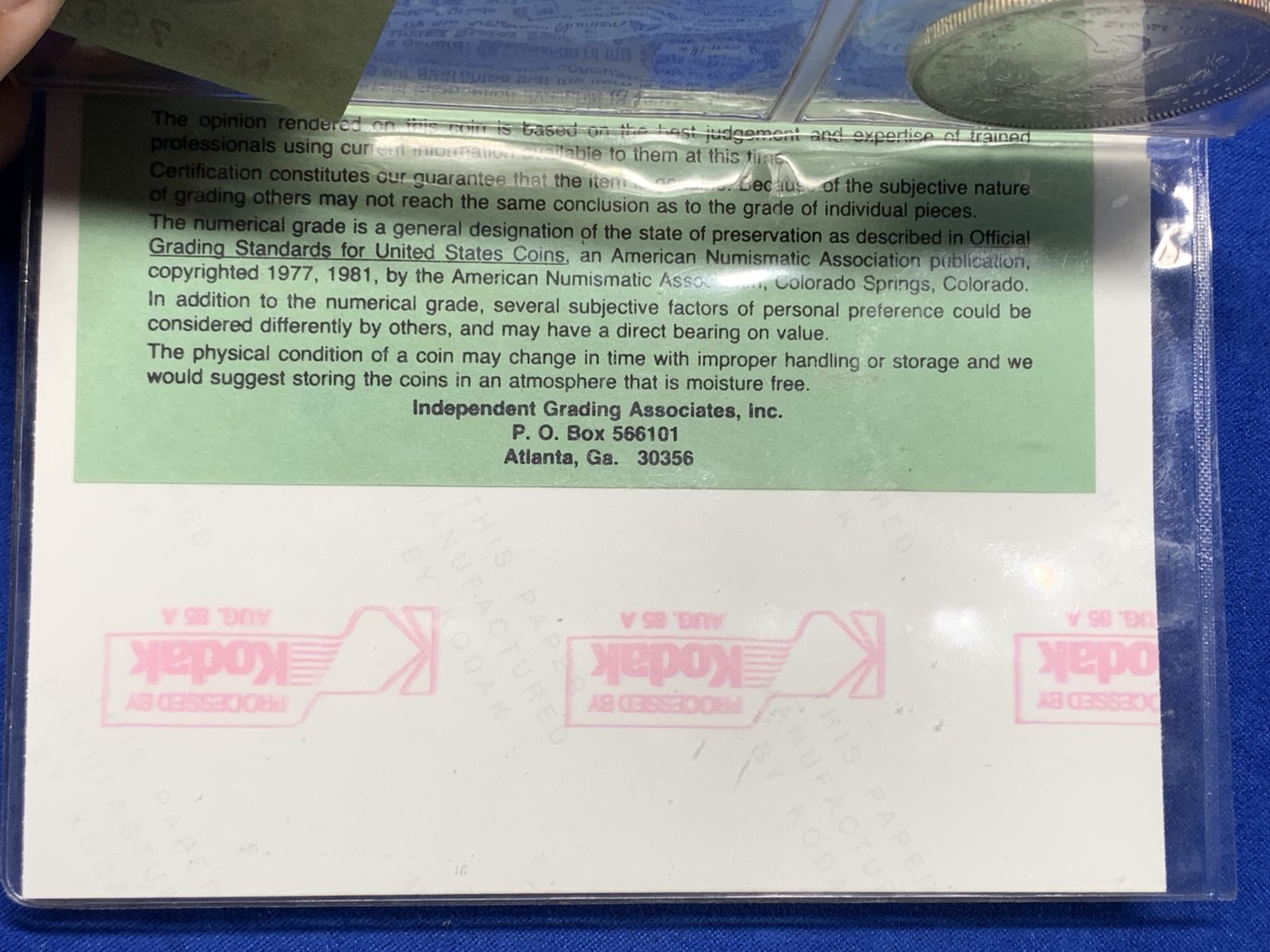 《竞宝斋》第194场-周日，周一 2场 (全场包邮) 早期ICG，80年代评级 MS64/65 美国1885年摩根大银币。ICG早期评级的产物，1985年8月27日评级。当时的评级规则是正反面分别评级，正面MS64，反面MS65，附柯达相纸印的币原始照片一张。