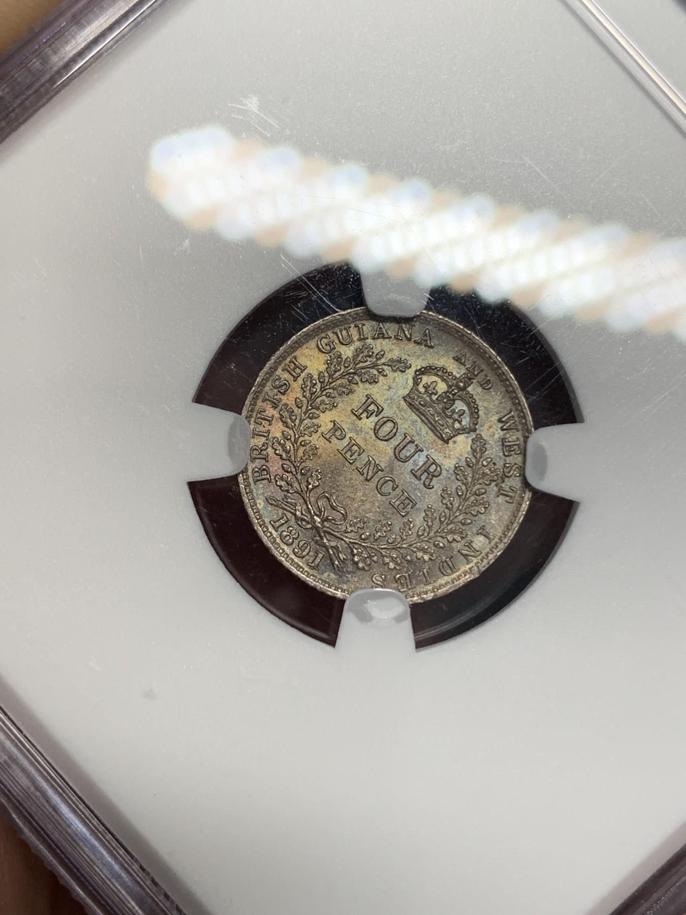 《竞宝斋》第195场-周日，周一 2场 (全场包邮) NGC-MS64 英属圭亚那 1891年 维多利亚女王4便士银币 币面五彩包浆