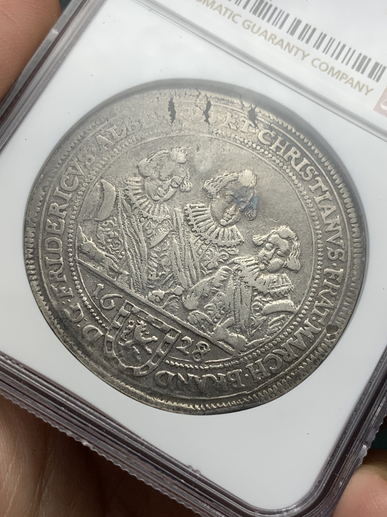 《竞宝斋》第195场-周日，周一 2场 (全场包邮) NGC AU50 1628/7骑字版  德国勃兰登堡 泰勒银币 非常难得品种 见到的基本为VFD状态 这枚NGC亚军（入盒仅2枚）这个时期萨克森居多