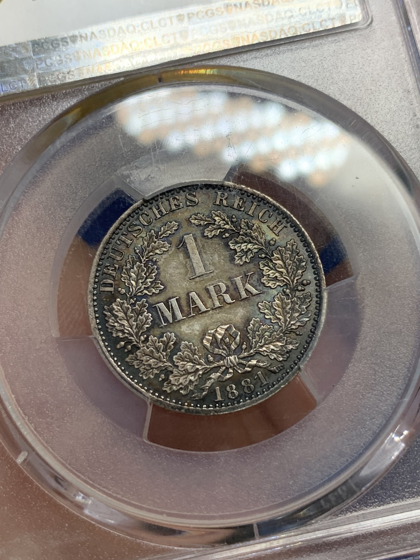 《竞宝斋》第195场-周日，周一 2场 (全场包邮) PCGS-MS63 德国1881年短翅鹰1马克银币，早期短翅帝国马克，原味黑彩，状态极佳。