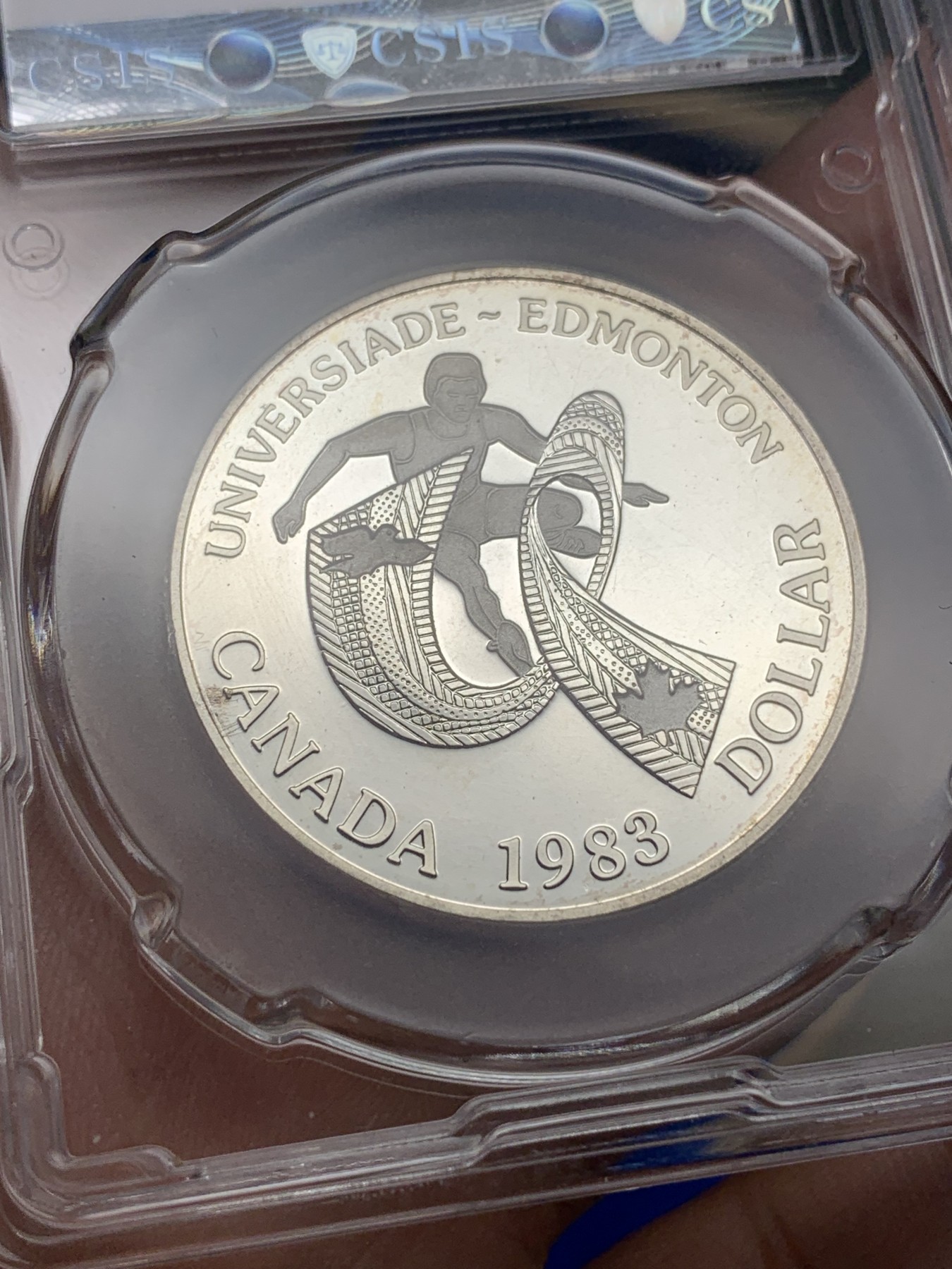 《竞宝斋》第195场-周日，周一 2场 (全场包邮) CSIS PF63 加拿大 1983年 埃德蒙顿大运会 一元 精制纪念 银币