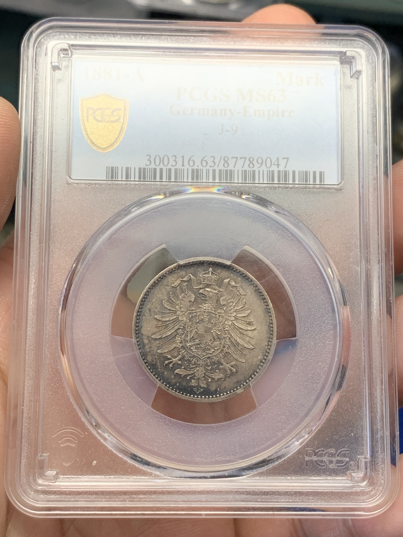 《竞宝斋》第195场-周日，周一 2场 (全场包邮) PCGS-MS63 德国1881年短翅鹰1马克银币，早期短翅帝国马克，原味黑彩，状态极佳。