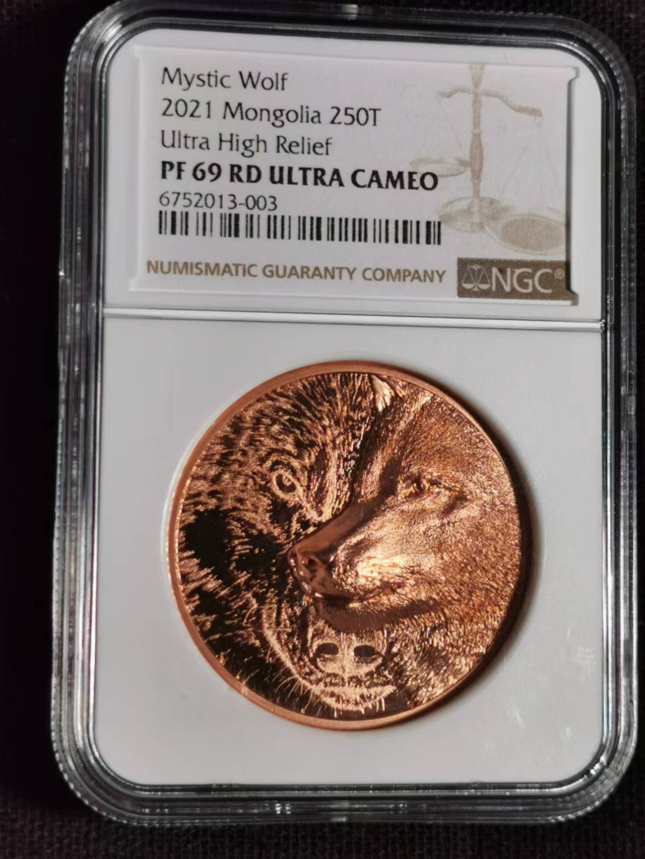 刘世昌艺术品销售中心～虎踞龙蟠*金杨在线联拍群第515期 蒙古2021年“草原狼～双面高浮雕”50克250图格里克精制纪念铜币（NGC  PF69RDUC   串号：6752013-003 ）1枚，原证书。