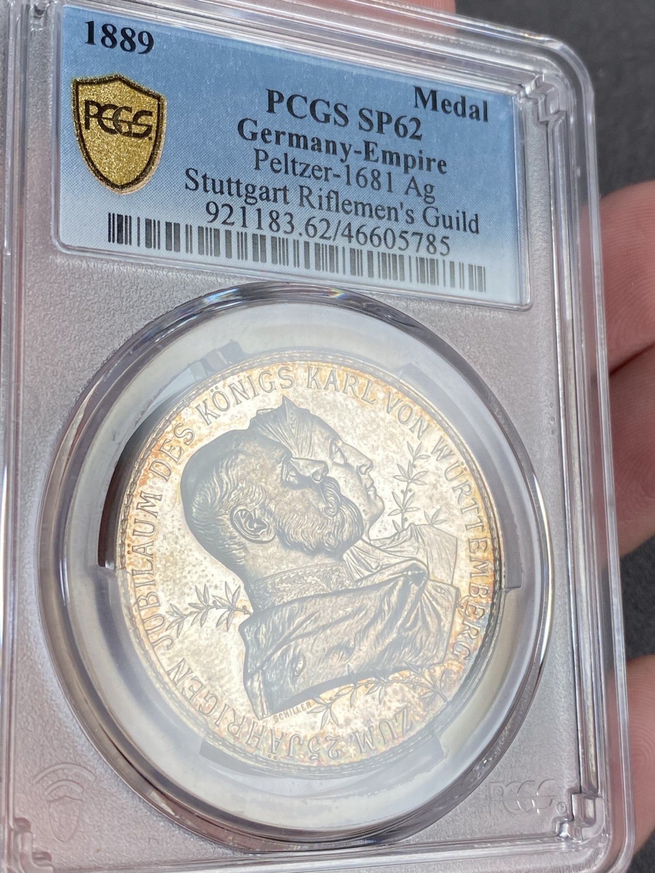 万国钱币拍卖第016期（奢华币章最终章） PCGS SP62 1889年德国符腾堡斯图加特纪念卡尔国王加冕25周年暨联邦射击节大银章 此品种所见几乎统统带有吊环 品种唯一冠军分 通体炫彩高浮雕 36MM 23G