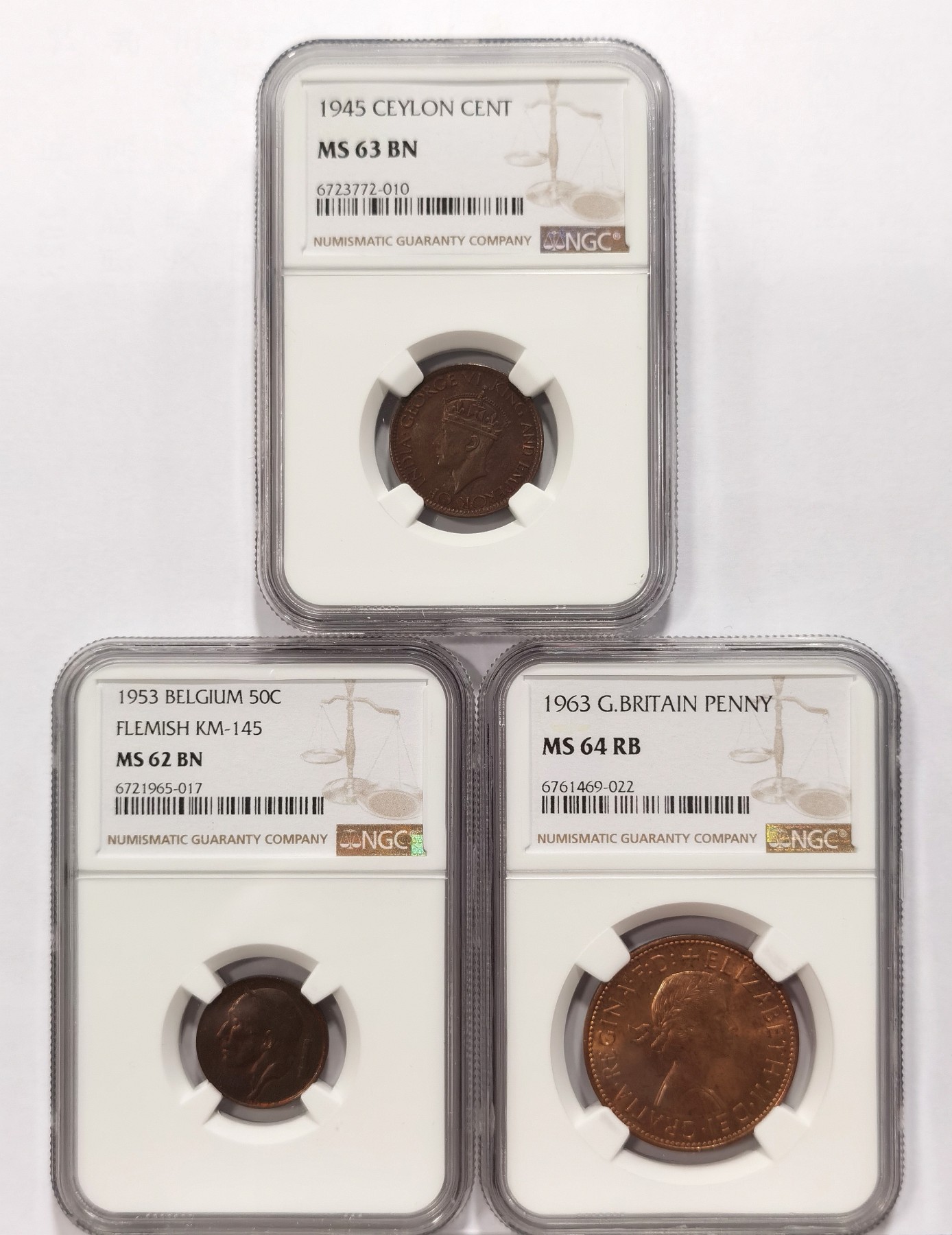 博洋堂世界钱币拍卖第042期周六场（全场包邮）本周五、周六二场连拍 NGC MS63/62/64三枚一组 英属锡兰1945年1分+比利时1953年50分+英国1963年1便士铜币 高分包浆醇厚，三种不同的铜光包浆，趣味性强，性价比高
