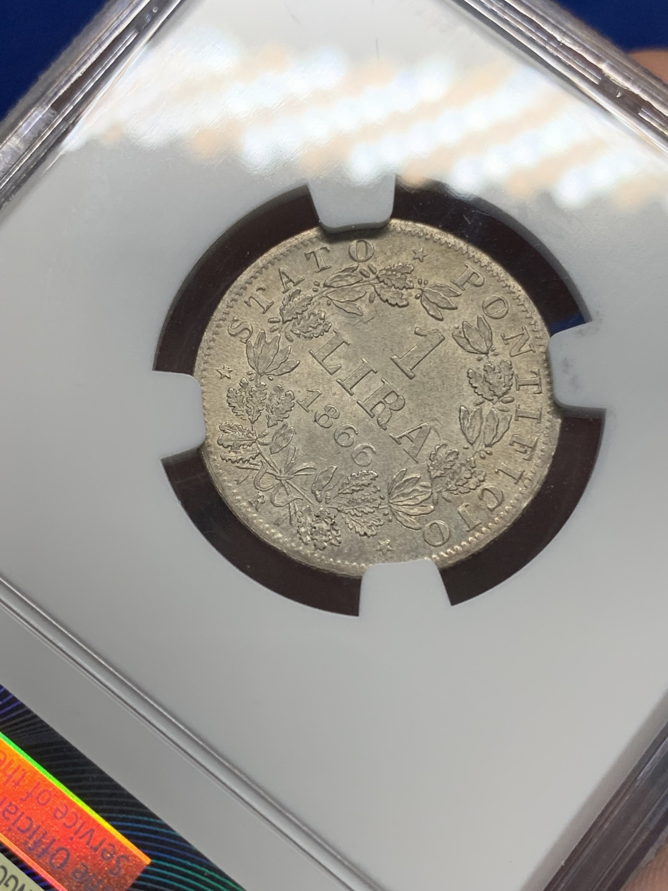 《竞宝斋》第196场-周日，周一 2场 (全场包邮) NGC-MS64 教皇国1866年庇护九世银里拉，同版首年份。最后一位兼任世俗君主的教皇，4年后罗马即被意大利攻陷。银光靓丽，64收藏级分数。