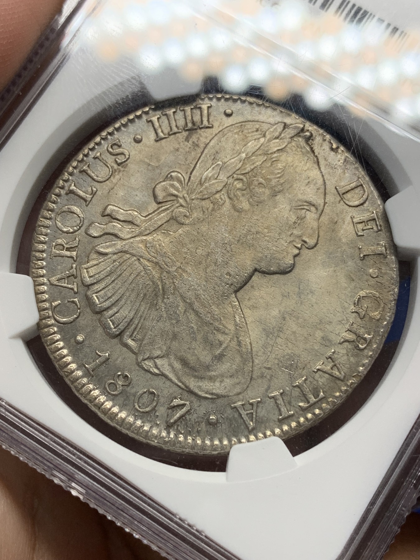 《竞宝斋》第196场-周日，周一 2场 (全场包邮) NGC-MS62 西属墨西哥1807 MO TH卡四 人像双柱 8瑞尔银币  双面淡彩