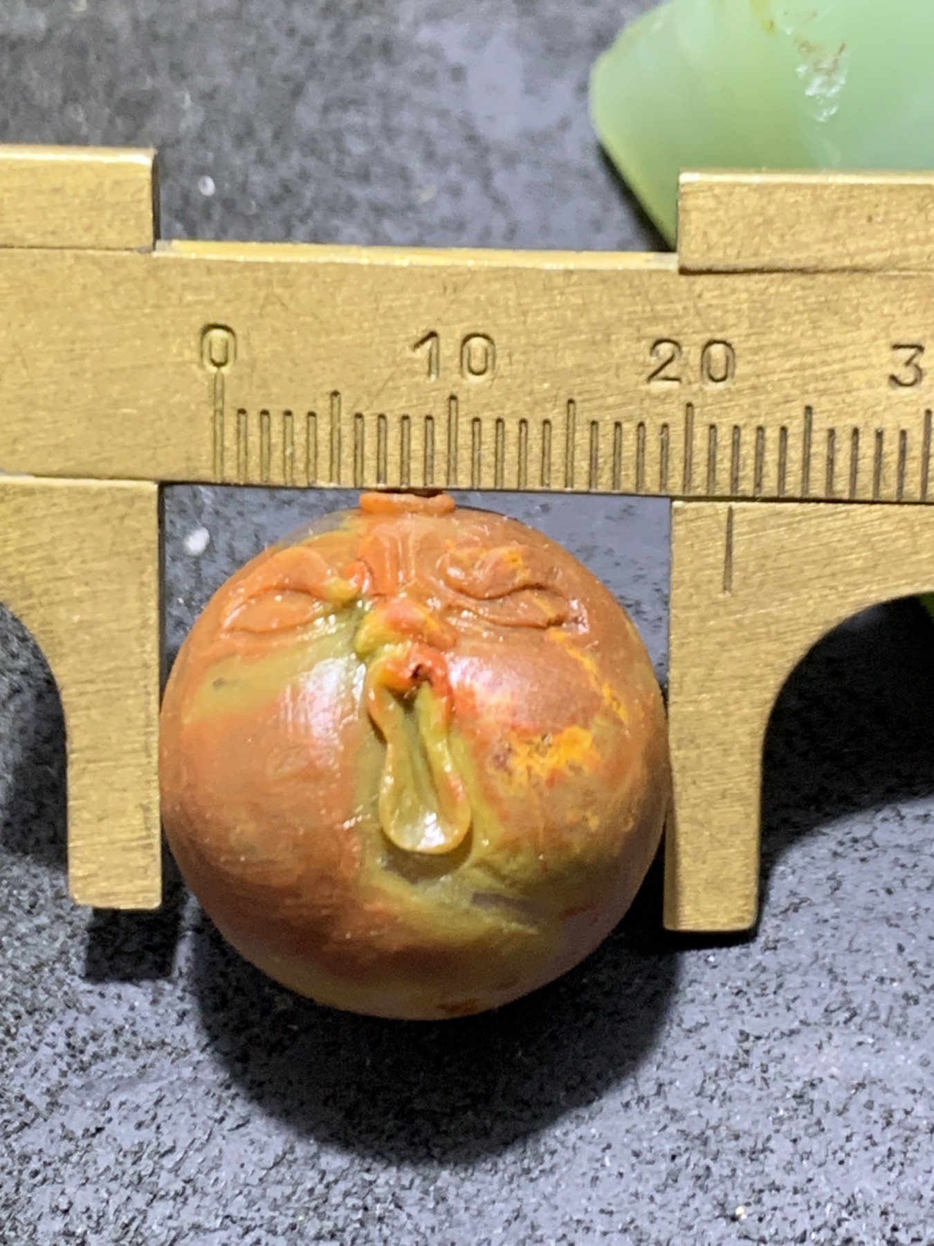 精美亚光高玉化战国红玛瑙手工雕刻怒目表情圆珠一个！