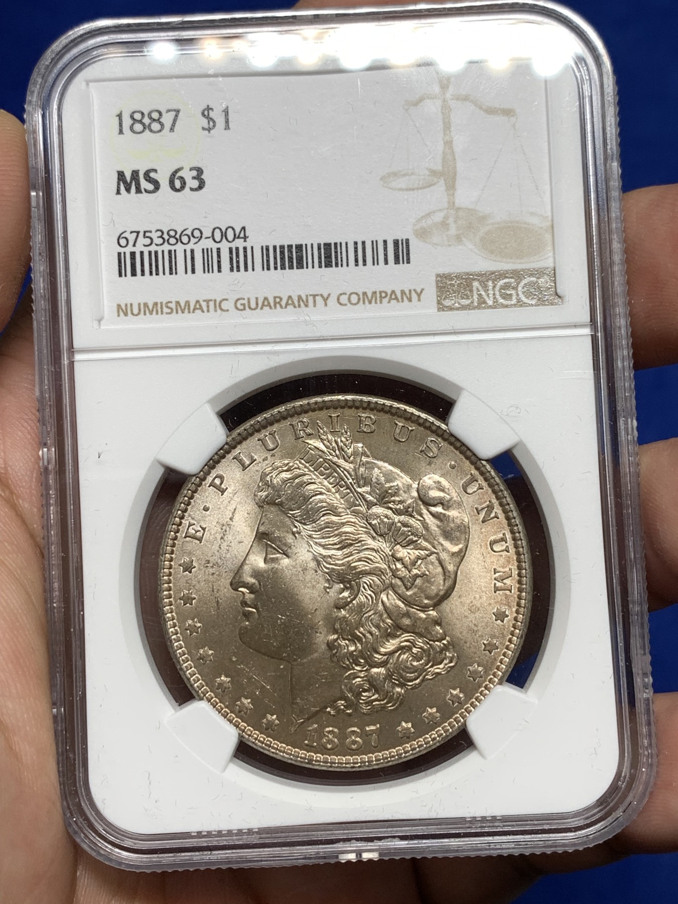 《竞宝斋》第198场-周日，周一 2场 (全场包邮) NGC-MS63 美国 1887年 摩根银币1美元 淡紫色包浆 转光感强烈