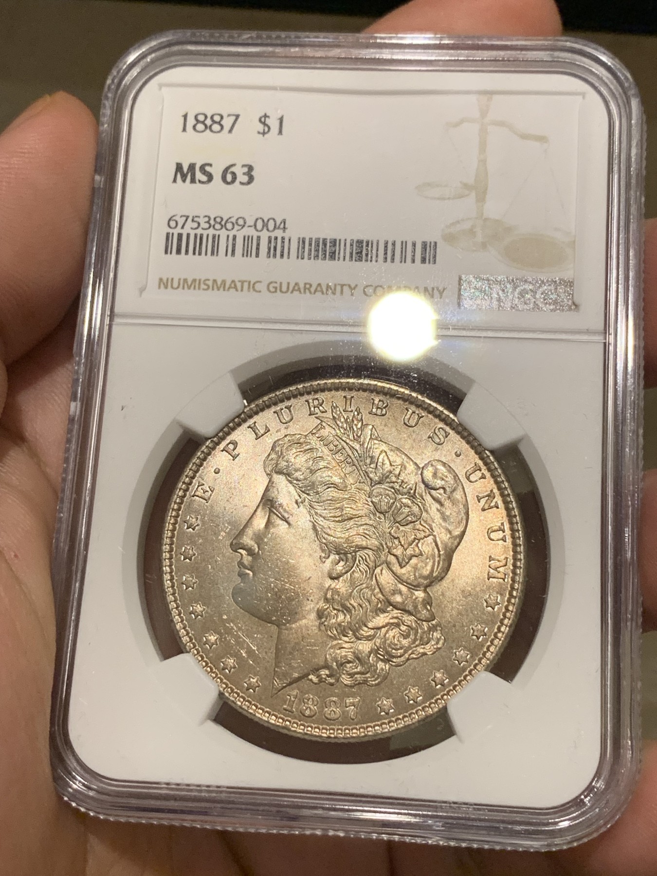 《竞宝斋》第198场-周日，周一 2场 (全场包邮) NGC-MS63 美国 1887年 摩根银币1美元 淡紫色包浆 转光感强烈