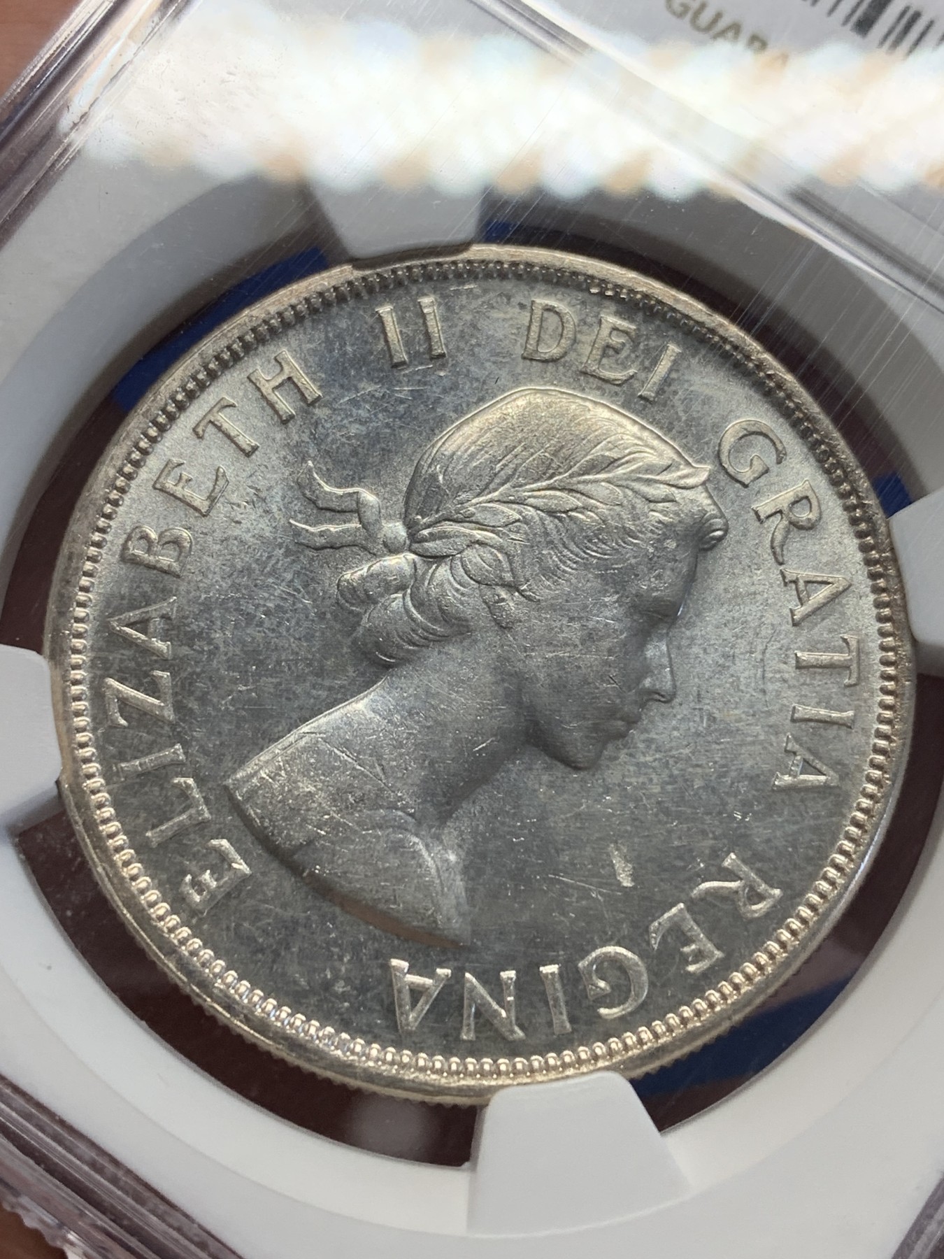 《竞宝斋》第201场-周日，周一 2场 (全场包邮) NGC MS64 1958年 加拿大 哥伦比亚百年纪念1元银币 高银版