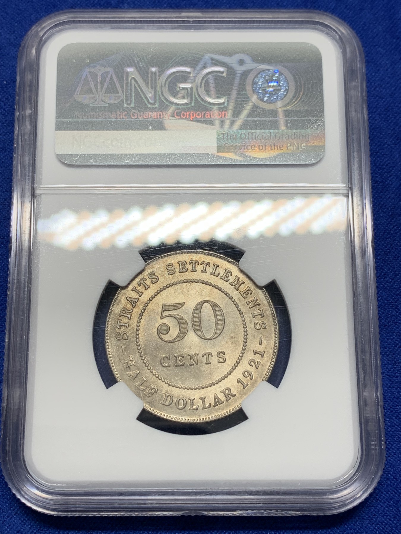 《竞宝斋》第201场-周日，周一 2场 (全场包邮) NGC-MS63 1921年英属海峡殖民地乔五50分银币，半圆大小。金彩包浆，车轮光。壹圆同分已经三四千起步，半圆仍具潜力。