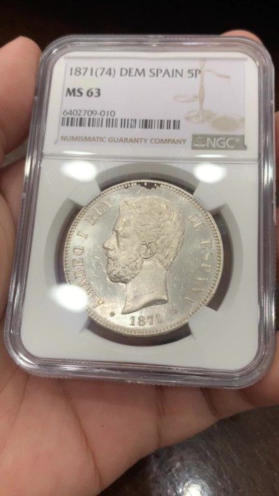 《竞宝斋》第201场-周日，周一 2场 (全场包邮) NGC-MS63 西班牙 1871(74) 阿马迪奥一世 5比塞塔双柱银币，比71的版本少很多，整体转光白净 稀缺品种高分难觅