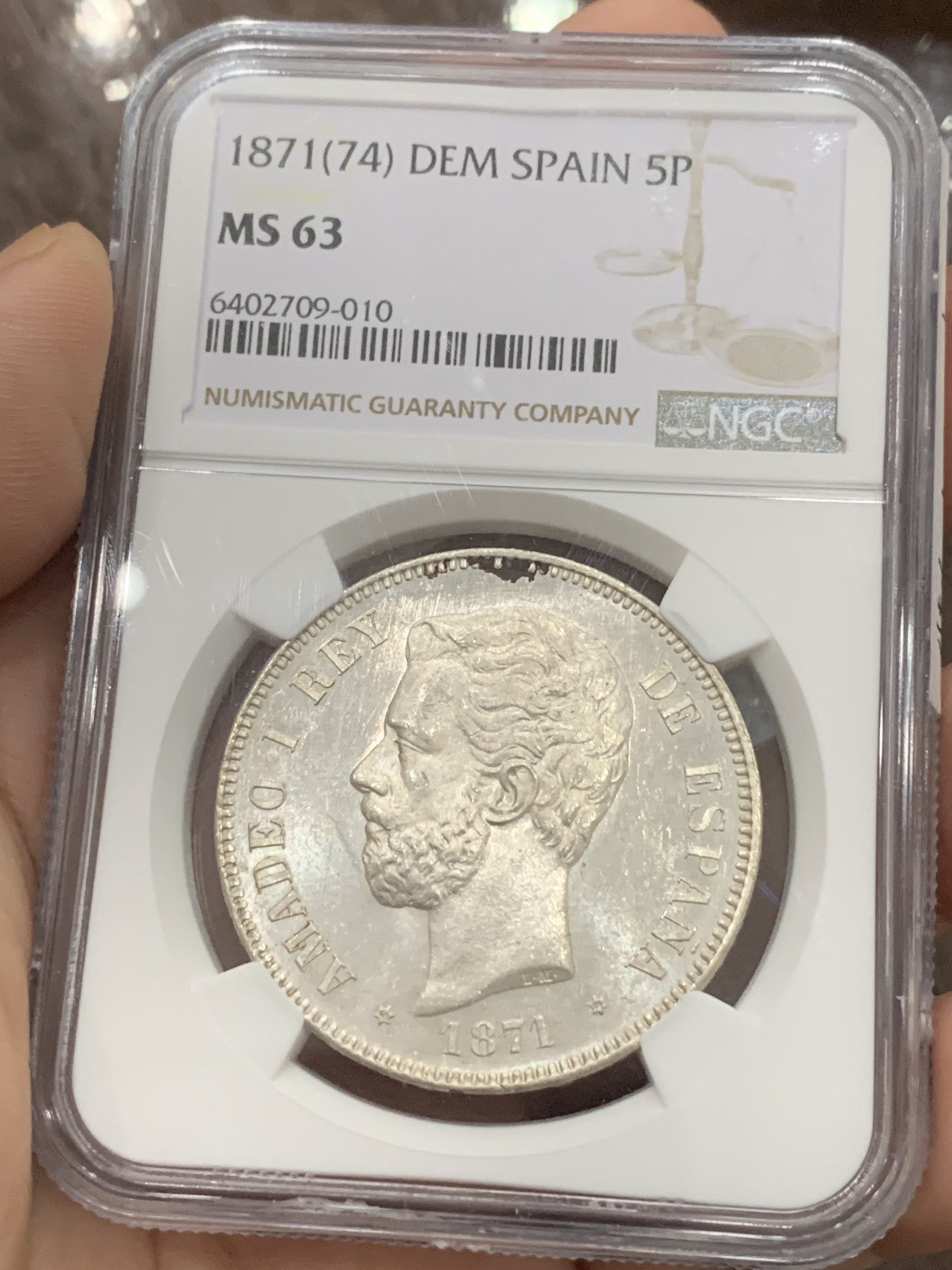 《竞宝斋》第201场-周日，周一 2场 (全场包邮) NGC-MS63 西班牙 1871(74) 阿马迪奥一世 5比塞塔双柱银币，比71的版本少很多，整体转光白净 稀缺品种高分难觅