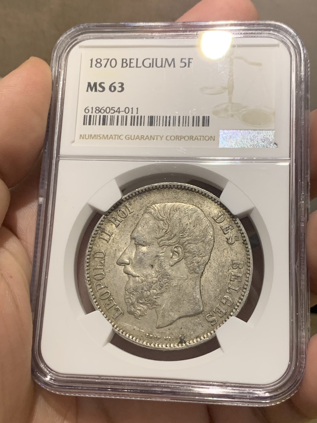 欢迎参加《竞宝斋》为国而庆 老张自藏专场 ，定制纪念章相赠 NGC MS63 比利时 1870年 5法郎银币 不是常见的1873年，63分已经很难遇到了