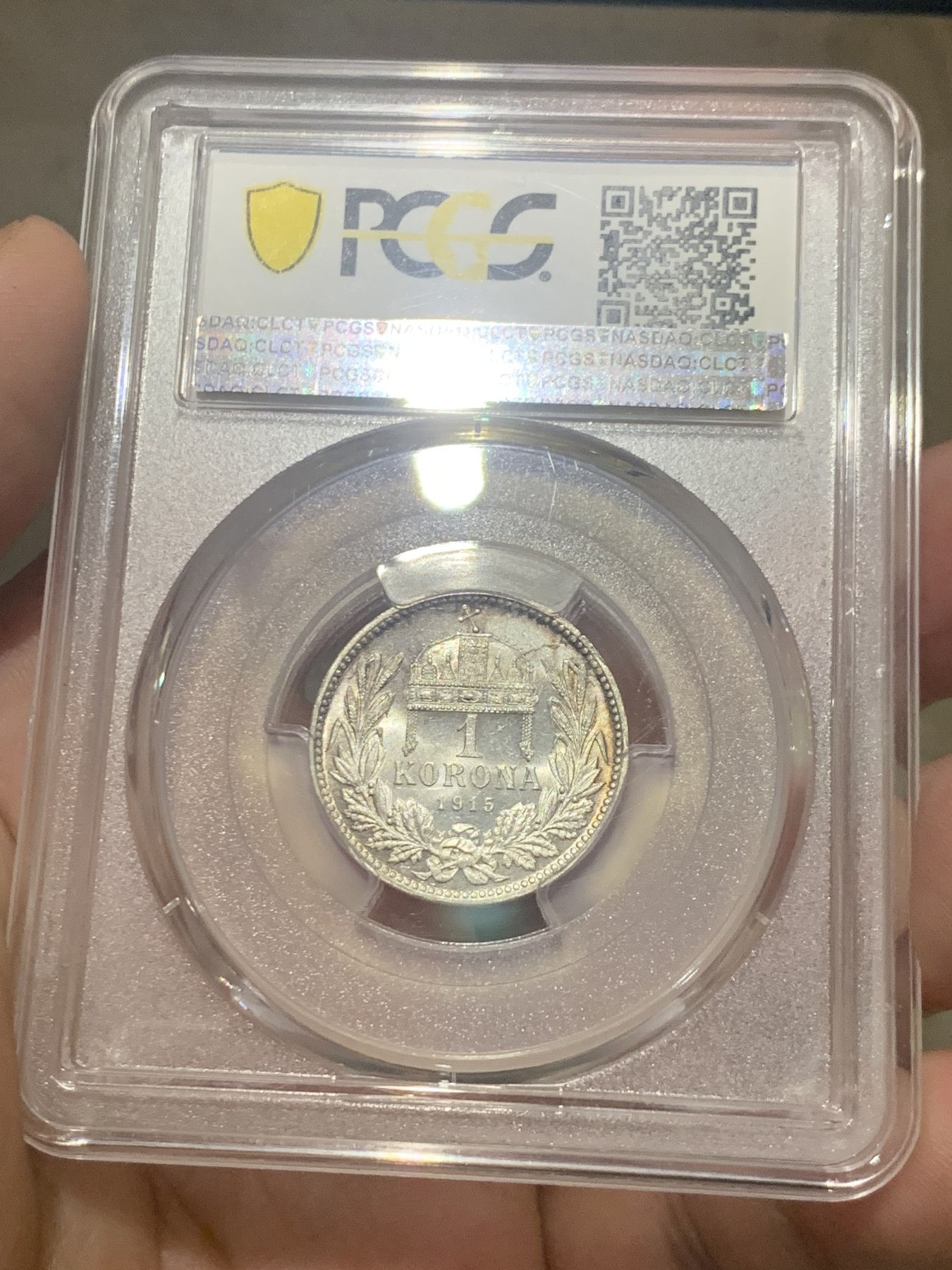 欢迎参加《竞宝斋》为国而庆 老张自藏专场 ，定制纪念章相赠 PCGS MS64 1915年奥匈帝国 匈牙利1克朗皇冠银币 状态没的说