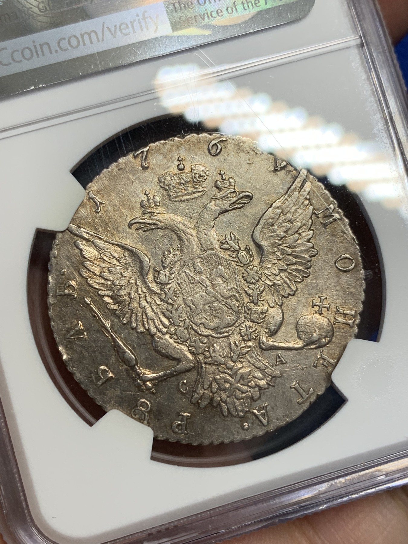 欢迎参加《竞宝斋》为国而庆 老张自藏专场 ，定制纪念章相赠 NGC AU 沙俄 叶卡捷琳娜二世 1769 1卢布银币 双面淡金包浆 底板光好 全深打 币胚完整 除了没给分 不输其它