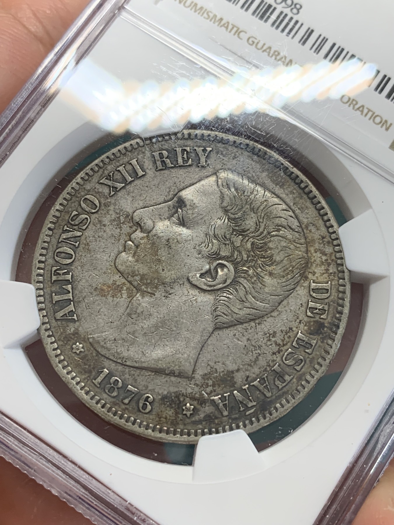 欢迎参加《竞宝斋》为国而庆 老张自藏专场 ，定制纪念章相赠 NGC-XF45 西班牙 1876 DEM 阿方索十二世双柱 5比塞塔银币 头发清晰 磨损少