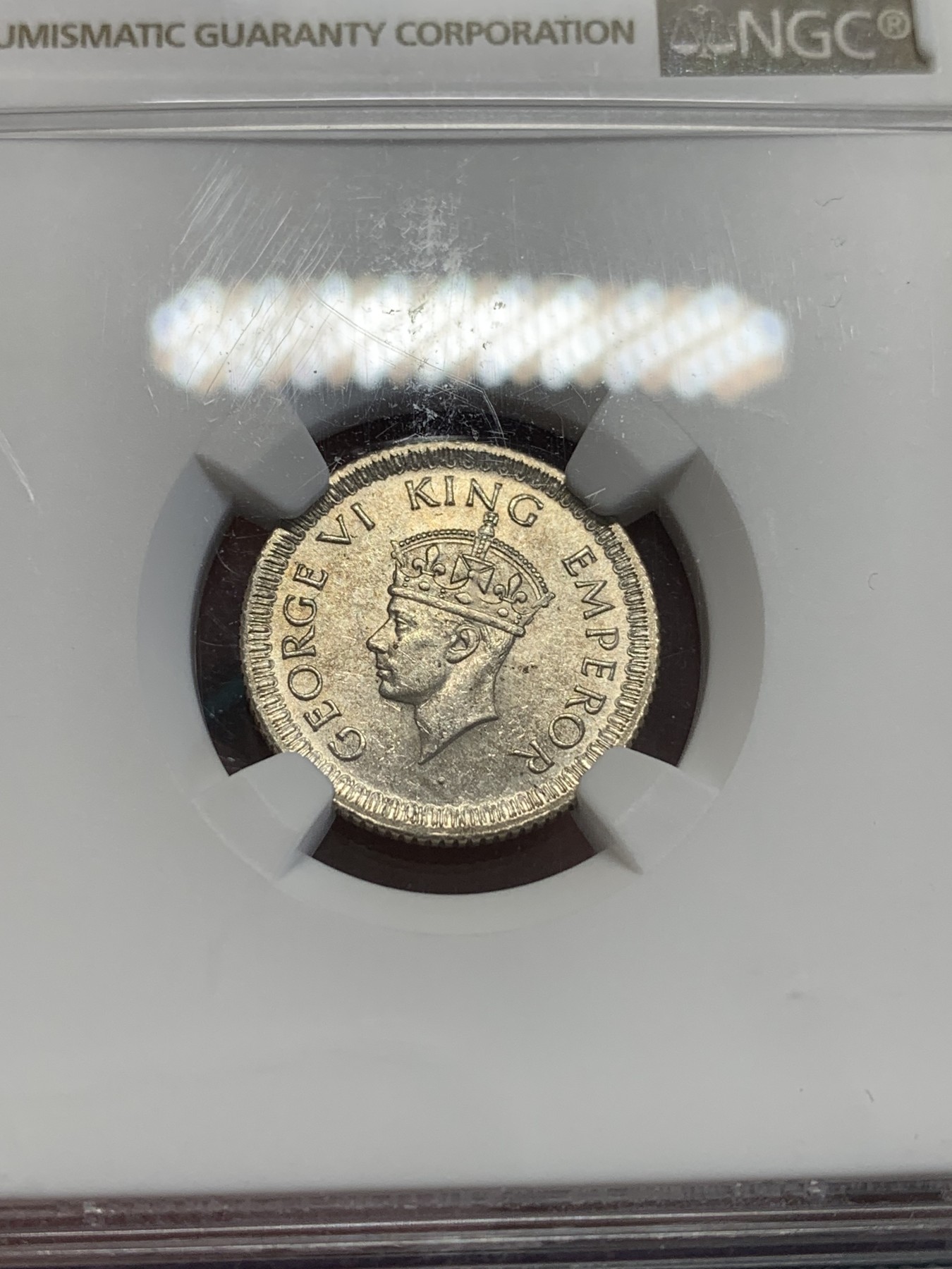 欢迎参加《竞宝斋》为国而庆 老张自藏专场 ，定制纪念章相赠 NGC MS63 英属印度 1942 乔六 1/4卢比银币 大面值常见 1/4的 流通大好品不容易
