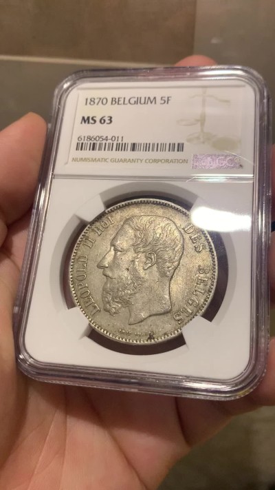 欢迎参加《竞宝斋》为国而庆 老张自藏专场 ，定制纪念章相赠 NGC MS63 比利时 1870年 5法郎银币 不是常见的1873年，63分已经很难遇到了