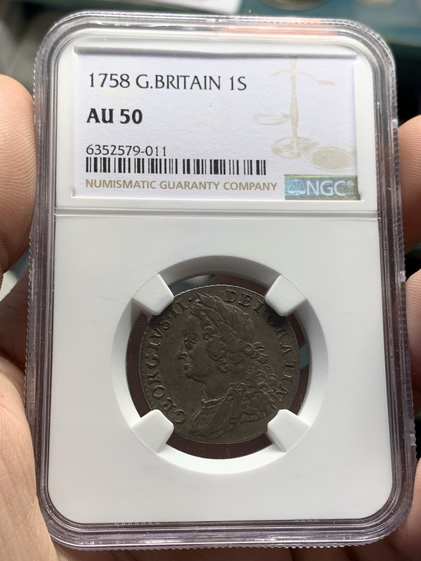 欢迎参加《竞宝斋》为国而庆 老张自藏专场 ，定制纪念章相赠 NGC AU50 英国 1758年 乔二 水泡眼 1先令 银币 原味深包浆 细节好