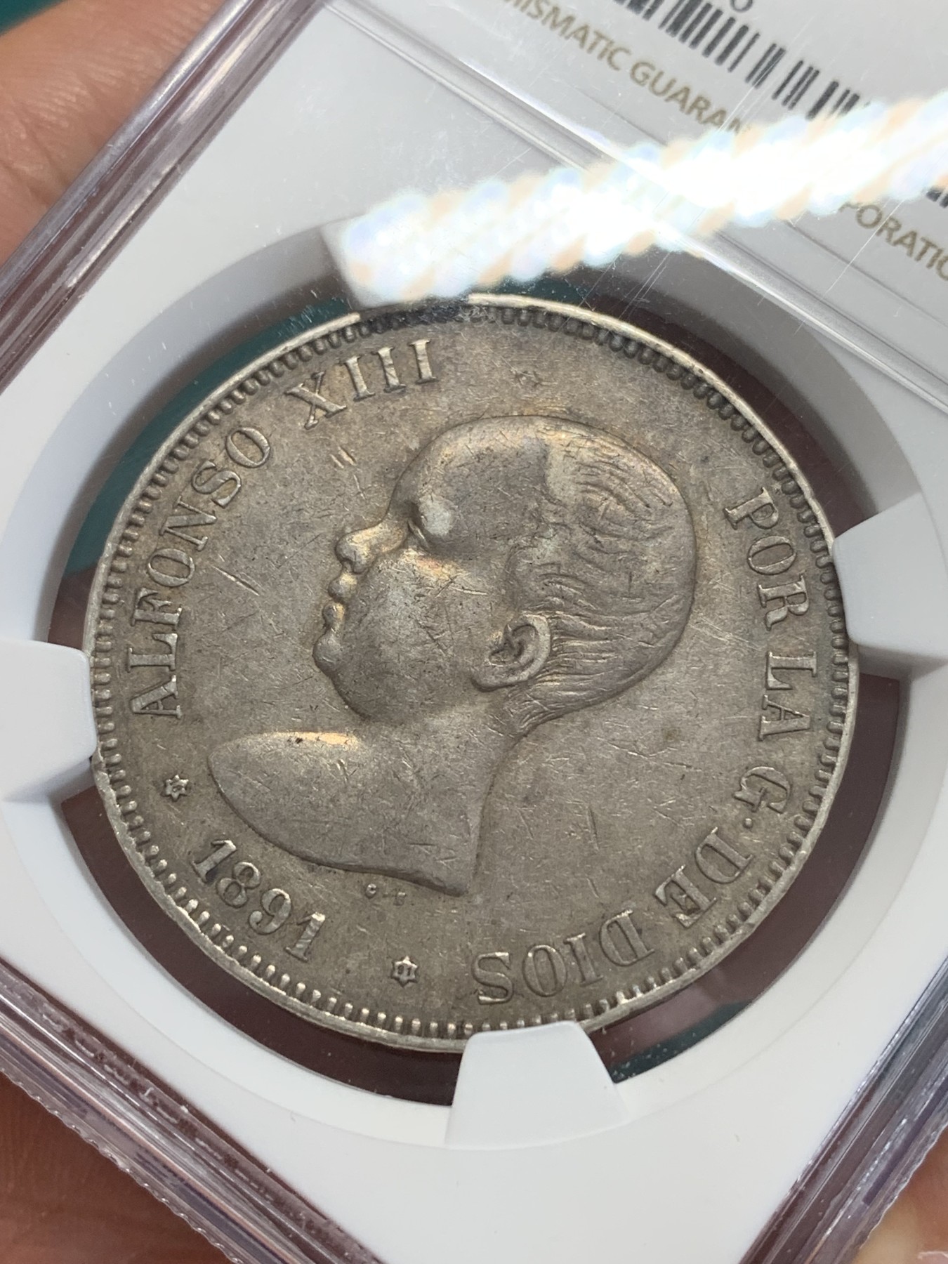 欢迎参加《竞宝斋》为国而庆 老张自藏专场 ，定制纪念章相赠 NGC AU50 西班牙1891年小光头5比塞塔银币 原味包浆 上50分不容易