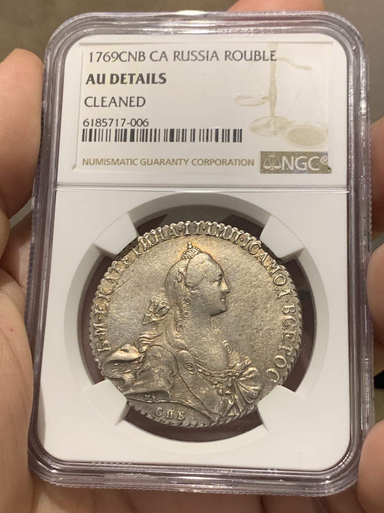 欢迎参加《竞宝斋》为国而庆 老张自藏专场 ，定制纪念章相赠 NGC AU 沙俄 叶卡捷琳娜二世 1769 1卢布银币 双面淡金包浆 底板光好 全深打 币胚完整 除了没给分 不输其它