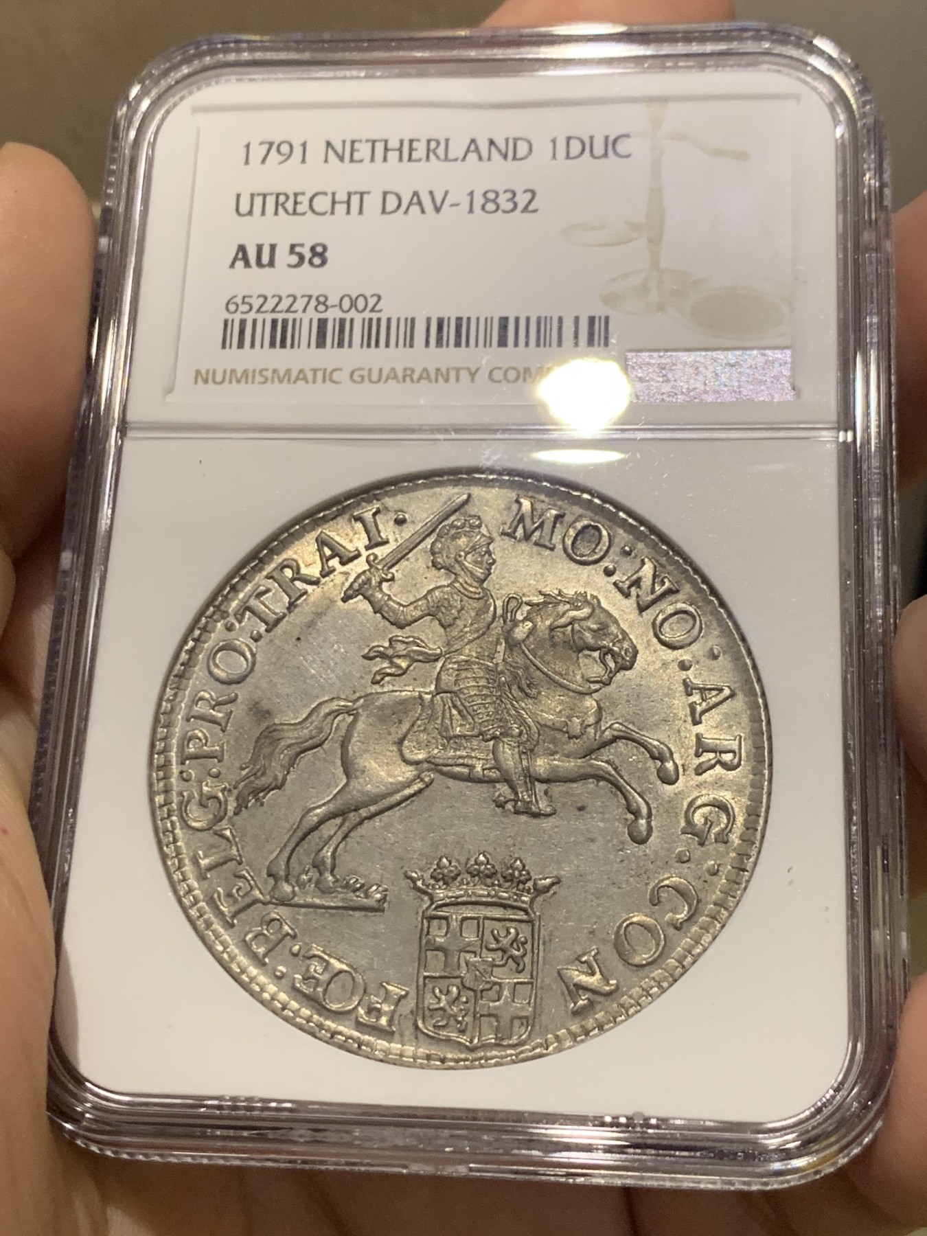 欢迎参加《竞宝斋》为国而庆 老张自藏专场 ，定制纪念章相赠 NGC AU58 荷兰 1791年 乌特勒支 骑士大马剑银币 32克多的大规格 细节极好 底光靓丽 58分中的战斗机