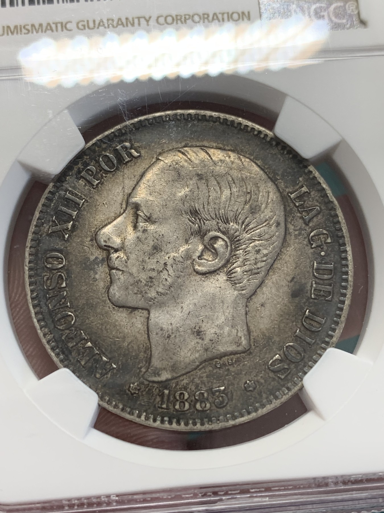 欢迎参加《竞宝斋》为国而庆 老张自藏专场 ，定制纪念章相赠 NGC XF45 西班牙1883年阿方索十二世5比塞塔银币 双面深彩包浆