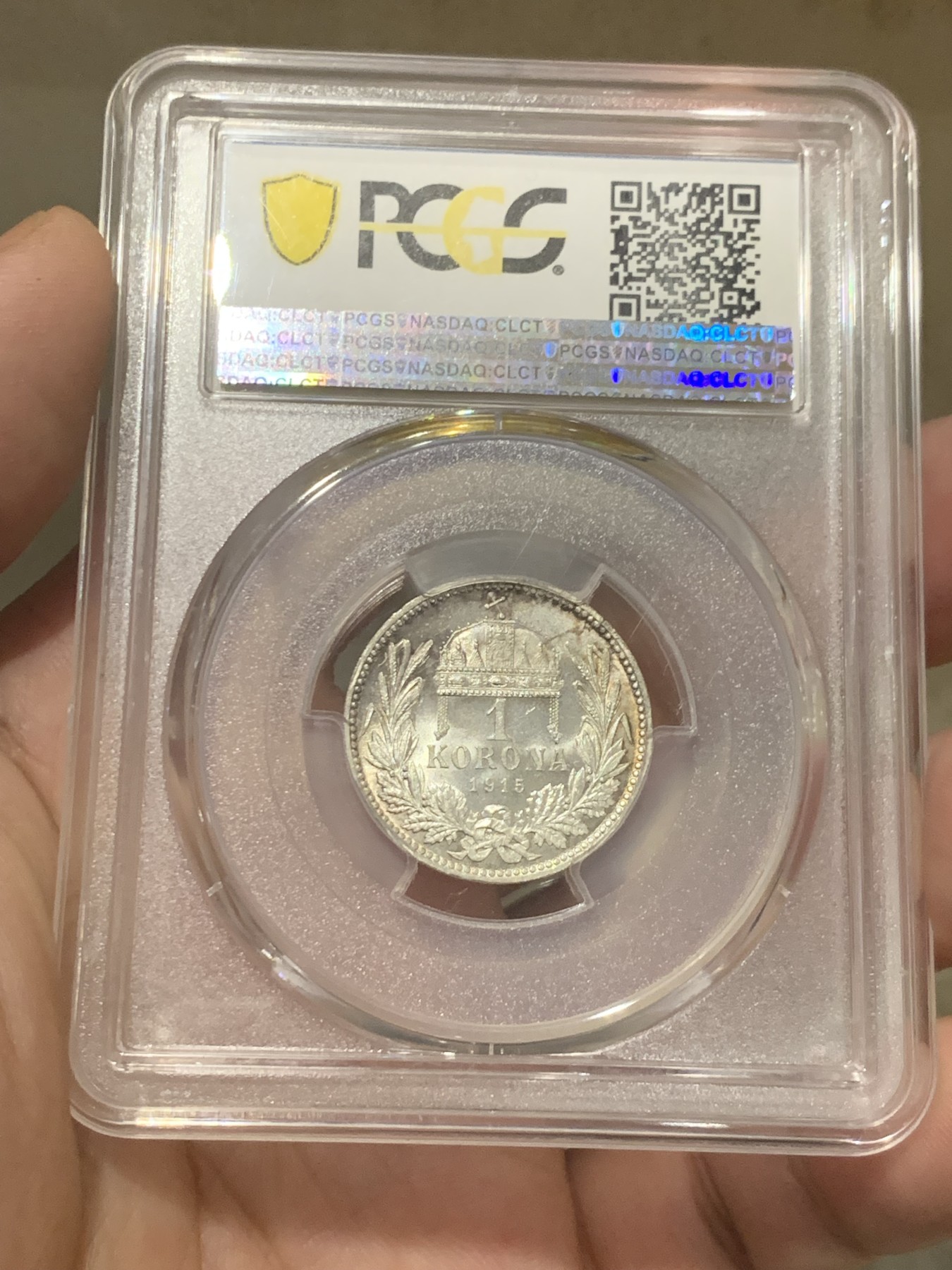 欢迎参加《竞宝斋》为国而庆 老张自藏专场 ，定制纪念章相赠 PCGS MS64 1915年奥匈帝国 匈牙利1克朗皇冠银币 状态没的说