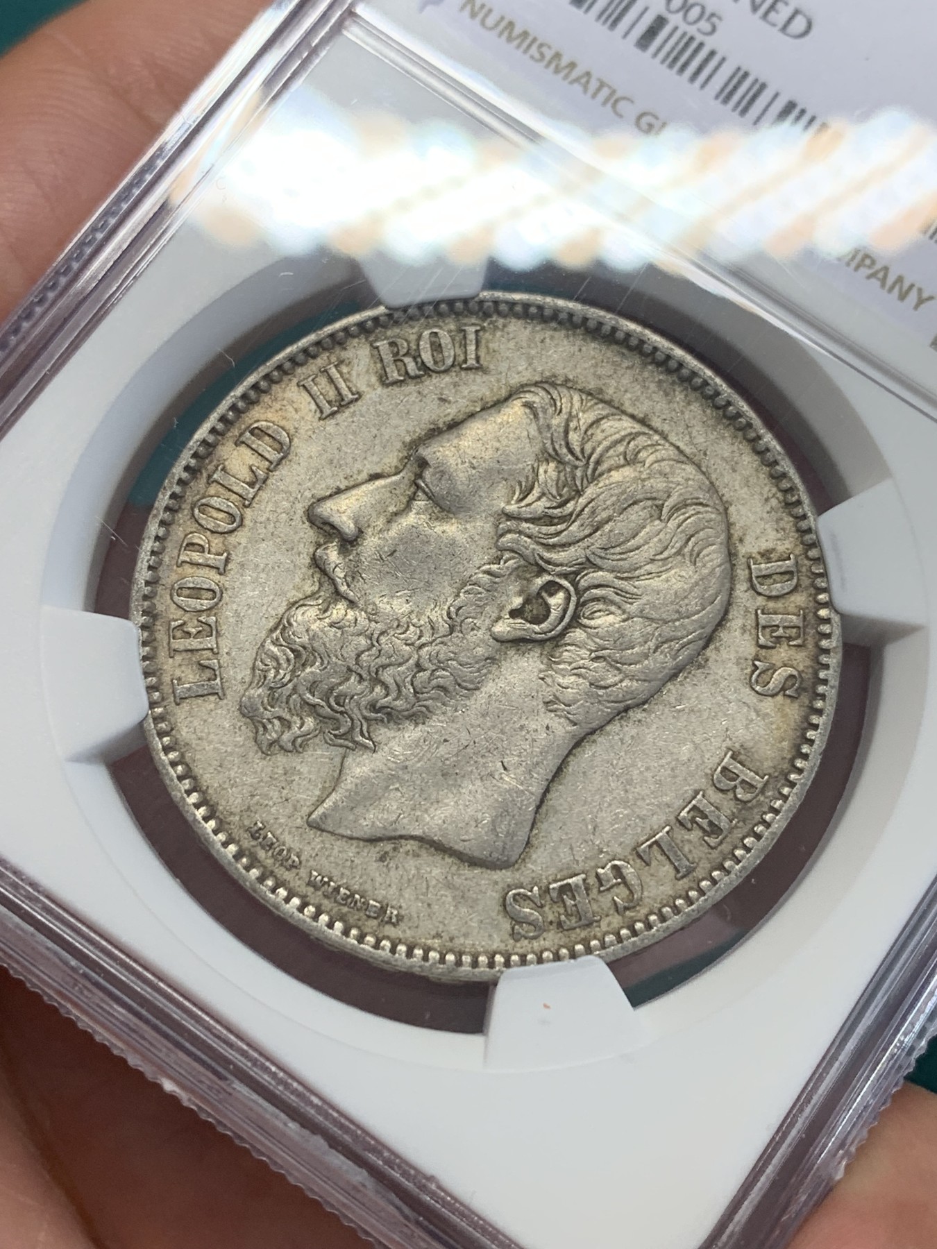 欢迎参加《竞宝斋》为国而庆 老张自藏专场 ，定制纪念章相赠 NGC AU 比利时1873年 利奥波德二世 5法郎银币 原味包浆 胡子清晰