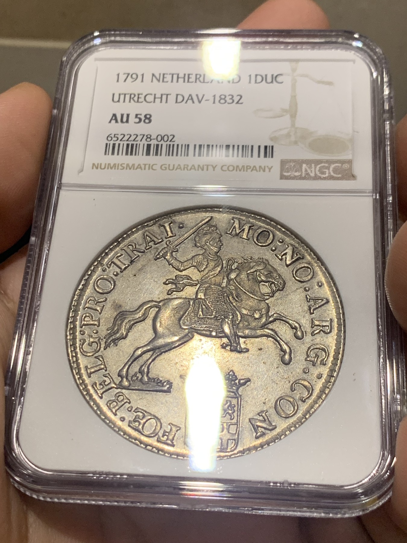 欢迎参加《竞宝斋》为国而庆 老张自藏专场 ，定制纪念章相赠 NGC AU58 荷兰 1791年 乌特勒支 骑士大马剑银币 32克多的大规格 细节极好 底光靓丽 58分中的战斗机