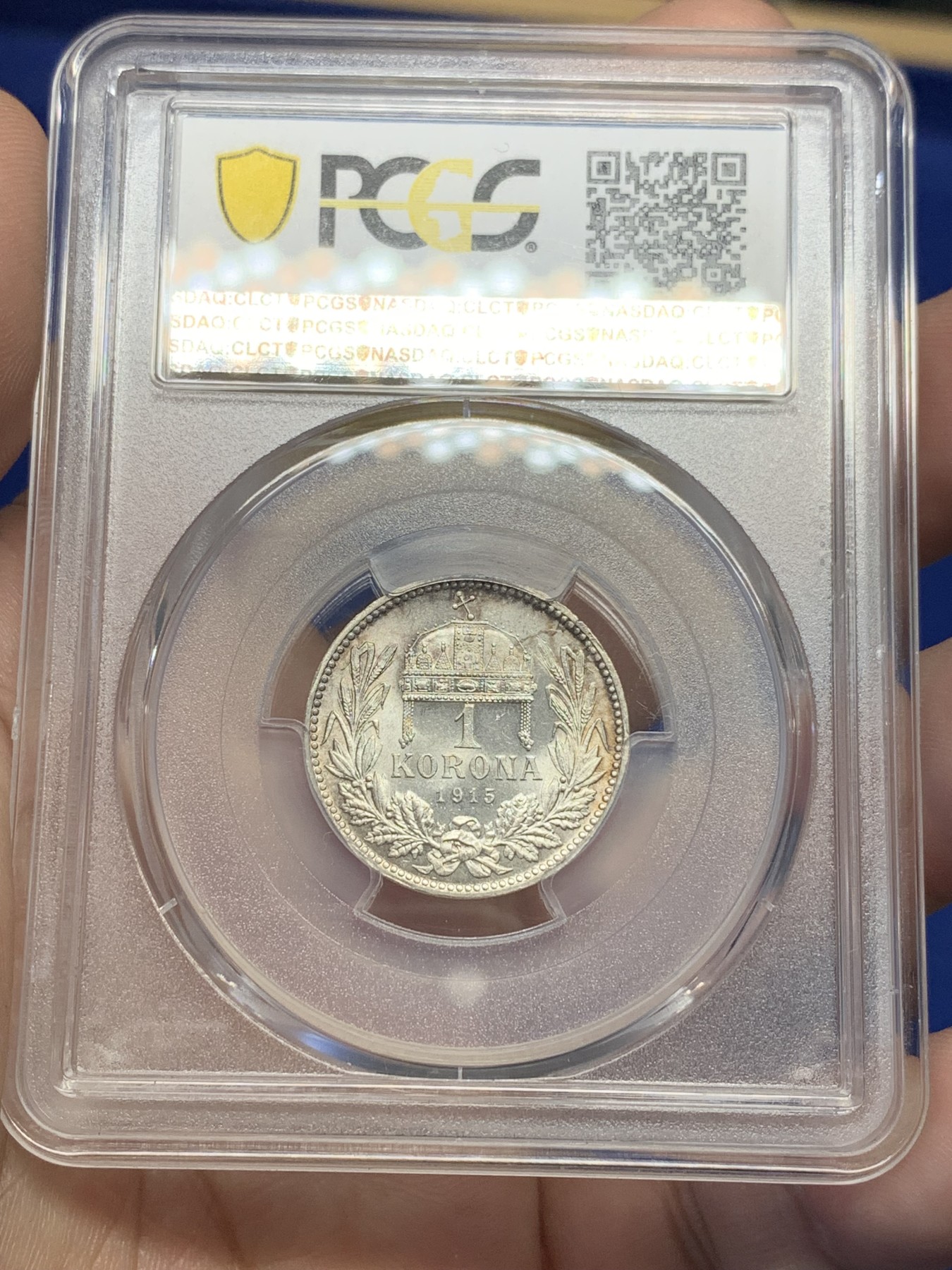 欢迎参加《竞宝斋》为国而庆 老张自藏专场 ，定制纪念章相赠 PCGS MS64 1915年奥匈帝国 匈牙利1克朗皇冠银币 状态没的说