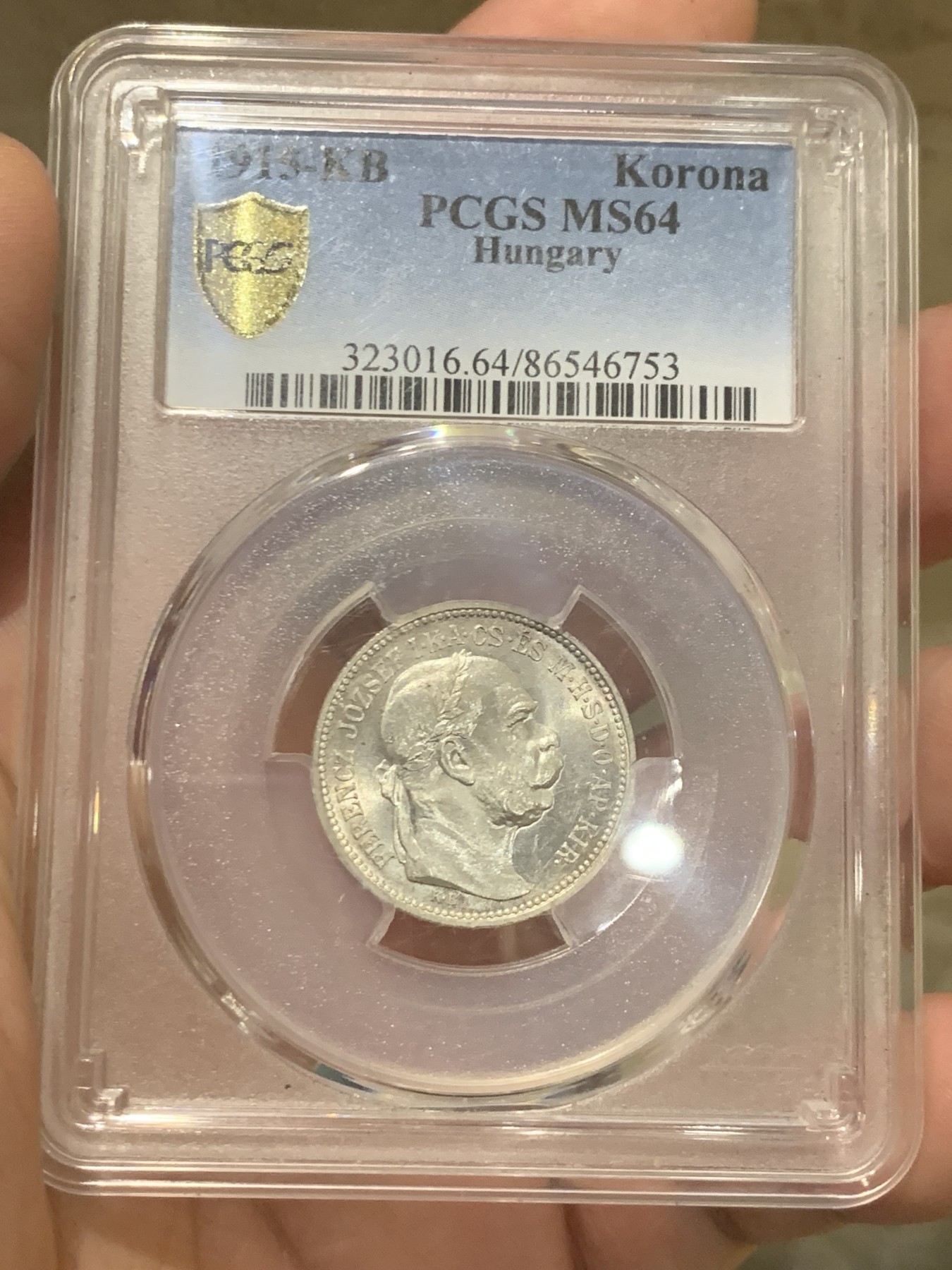 欢迎参加《竞宝斋》为国而庆 老张自藏专场 ，定制纪念章相赠 PCGS MS64 1915年奥匈帝国 匈牙利1克朗皇冠银币 状态没的说