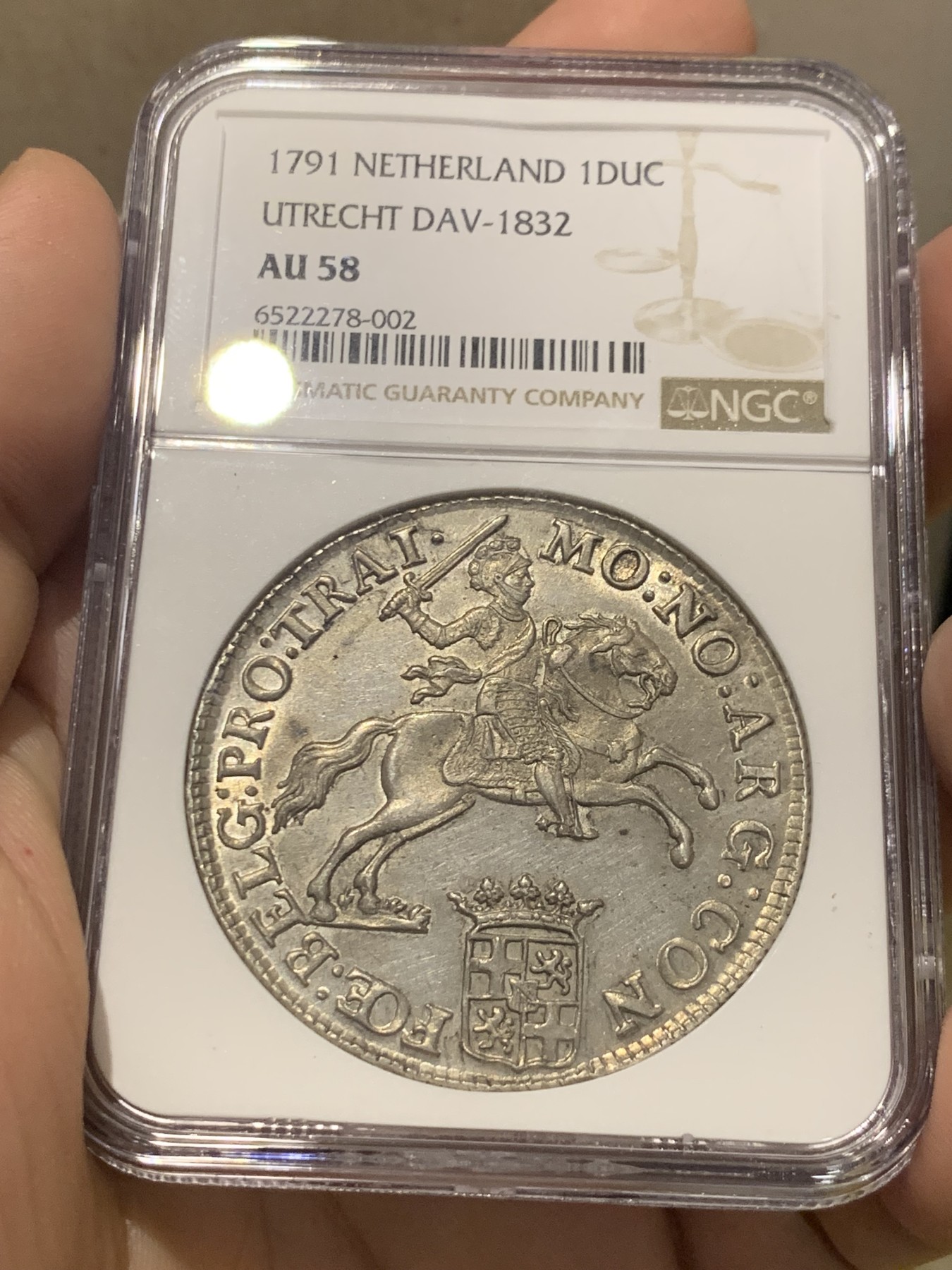 欢迎参加《竞宝斋》为国而庆 老张自藏专场 ，定制纪念章相赠 NGC AU58 荷兰 1791年 乌特勒支 骑士大马剑银币 32克多的大规格 细节极好 底光靓丽 58分中的战斗机