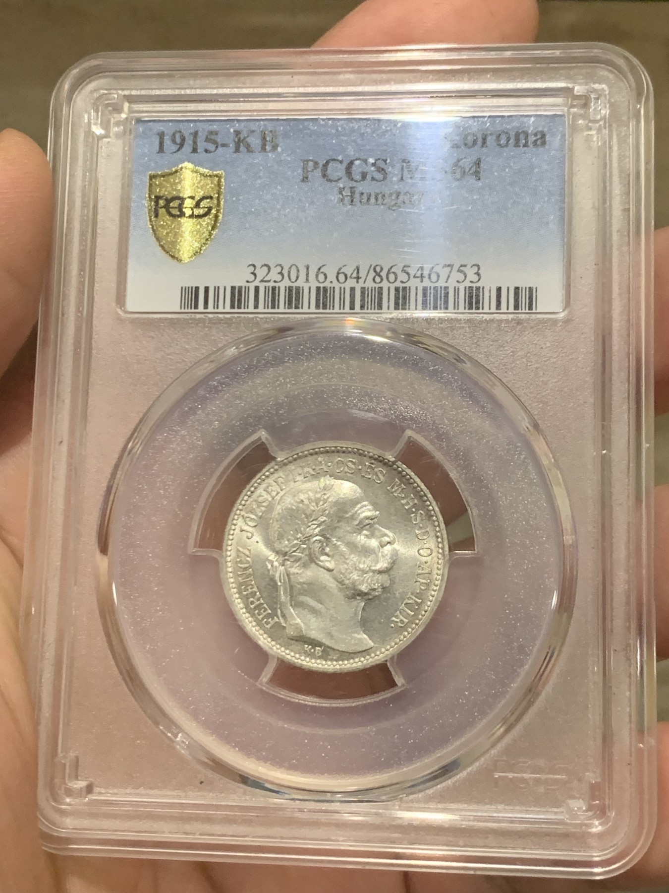 欢迎参加《竞宝斋》为国而庆 老张自藏专场 ，定制纪念章相赠 PCGS MS64 1915年奥匈帝国 匈牙利1克朗皇冠银币 状态没的说