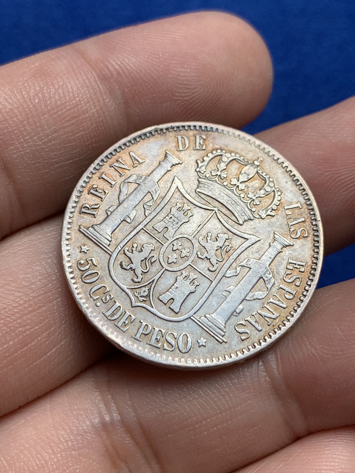 欢迎参加《竞宝斋》为国而庆 老张自藏专场 ，定制纪念章相赠 西属菲律宾 1868 伊莎贝拉二世 猪头妹 半比索银币 发行量只有43万枚 比本土的难见很多 半圆型面值