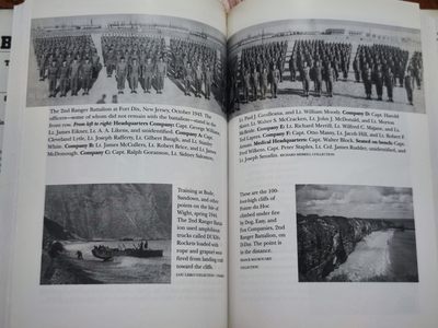 世界精品徽章拍卖-节后首场 《拯救大兵瑞恩》同部队士兵的勋章和第2游骑兵营的介绍书籍，《拯救大兵瑞恩》中汤姆汉克斯扮演的米勒上尉的原型便是当时的C连连长戈兰森上尉，而勋章的主人罗伯特则隶属于当时的A连，他们是在C连之后的第二波登上奥马哈滩头的部队